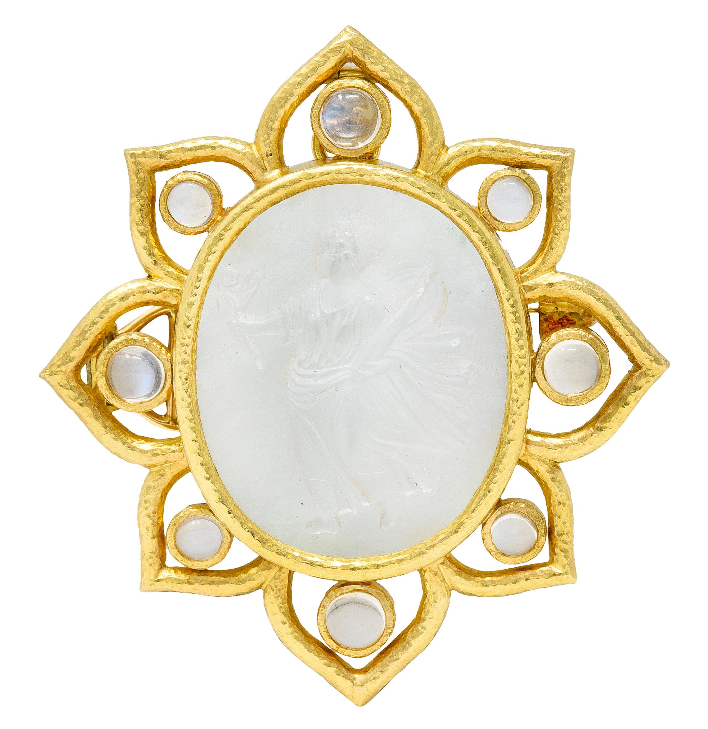 Pendant brooch is a radial burst form centering a bezel set 25.0 mm x 30.0 mm Venetian glass cameo

Transparent and colorless - backed by iridescent mother-of-pearl

Depicting the Roman goddess Flora holding her iconic flowers and vase

Featuring
