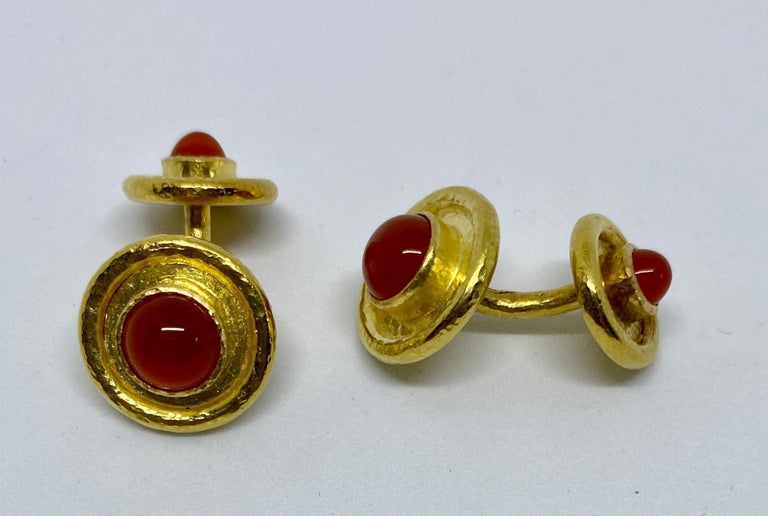 Beautiful, double-sided cufflinks in hammered 18K yellow gold with cabochon-cut carnelians by Elizabeth Locke. 

The circular faces measure 15.9mm in diameter; the backs measure 13.2mm in diameter. Each is inset with a richly colored carnelian cut
