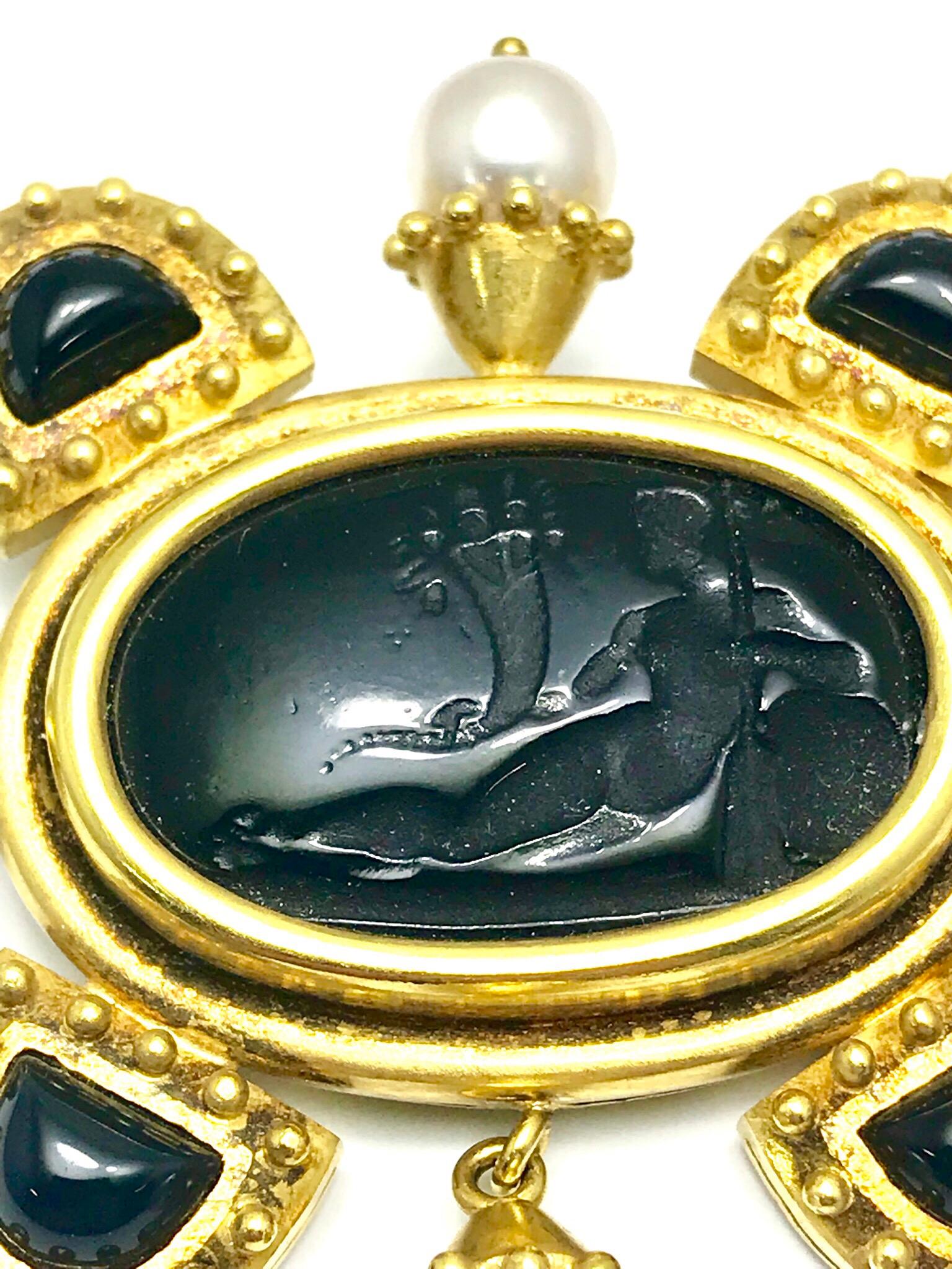 Elizabeth Locke bezel set onyx intaglio brooch in 18 karat yellow gold, with cultured pearls extending from the center, and cabochon onyx pieces surrounded by beaded gold.  The brooch features a double pin back for more stability.  Signed with the