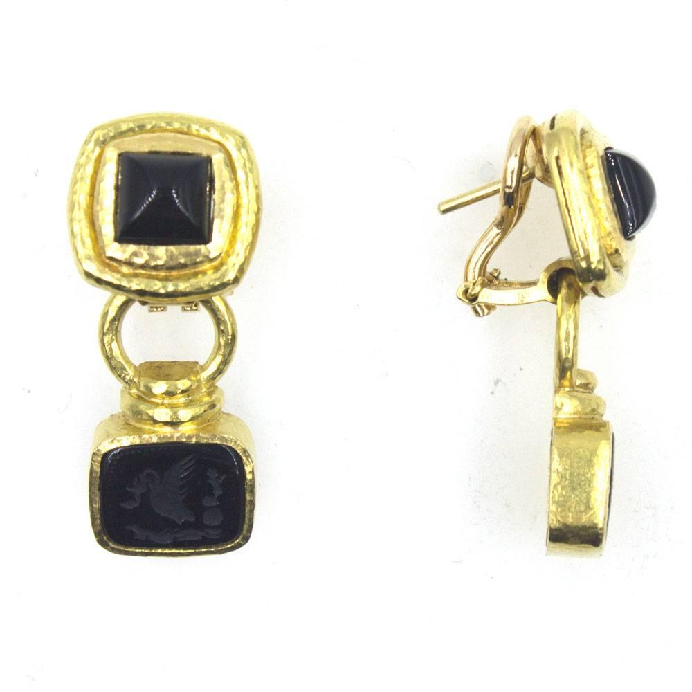 Beautiful elegant earrings by designer Elizabeth Locke. These onyx intaglio drop earrings are fashioned in hammered 19 karat yellow gold. The earrings can be worn as clips or with a post (retractable post), and measure 1.25 inches in length. Signed