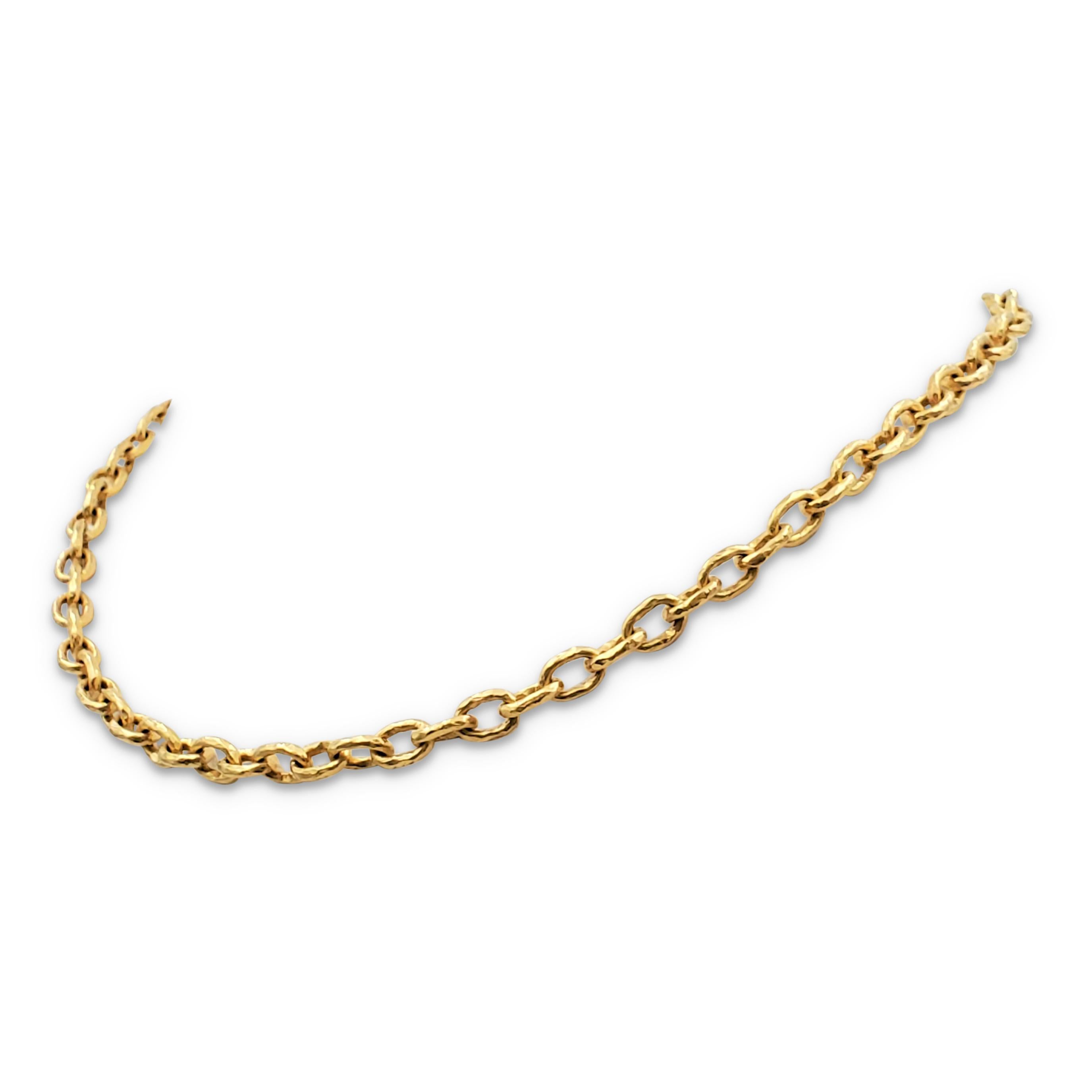 Authentic Elizabeth Locke necklace crafted in lustrous hammered 19 karat gold is comprised of interlocking round links. Granulated end-caps detail the toggle closure. Signed EL, 19K. The necklace measures 17 inches in length. Not presented with the