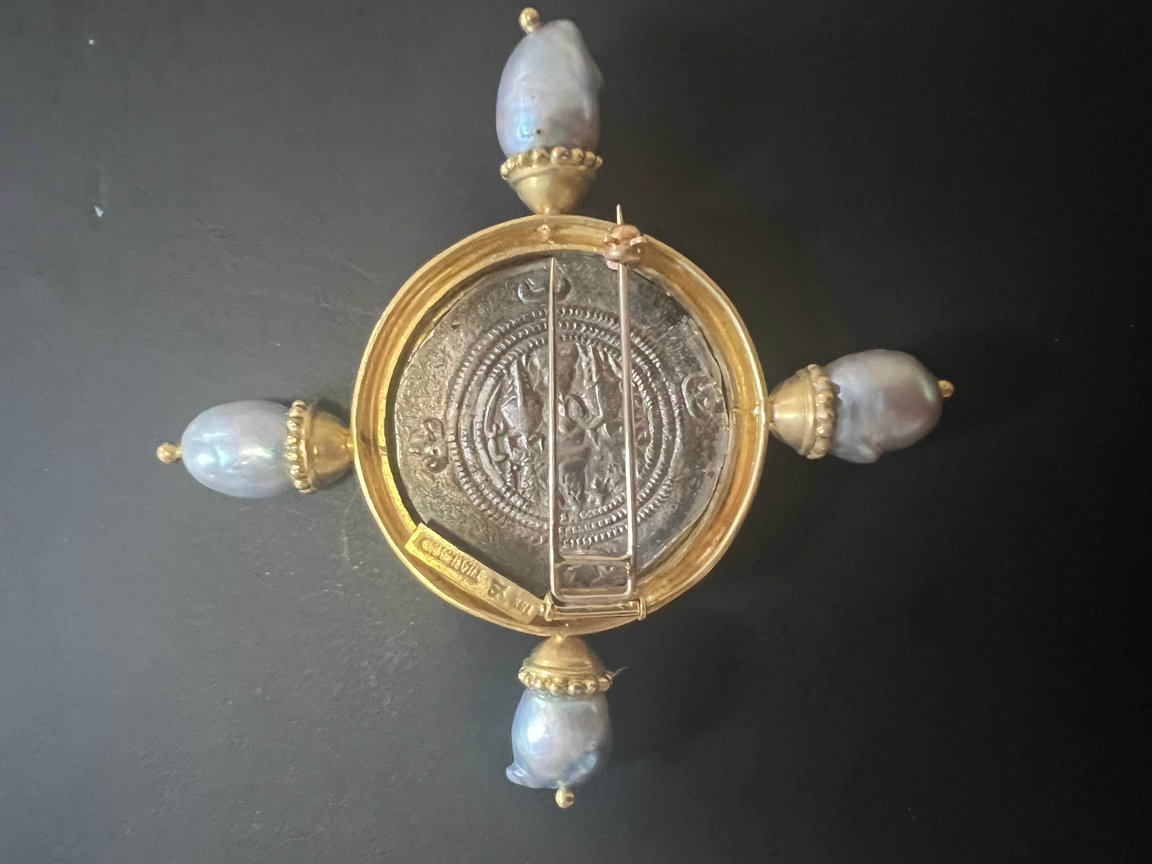 An exquisite Silver Sasanian Coin Depicting Xusro I ( circa 300AD) with Baroque South Sea Pearls in an 18K Gold Frame Brooch or Pin by the legendary jewelry designer Elizabeth Locke. 
The finely crafted brooch features an 18 K yellow solid frame