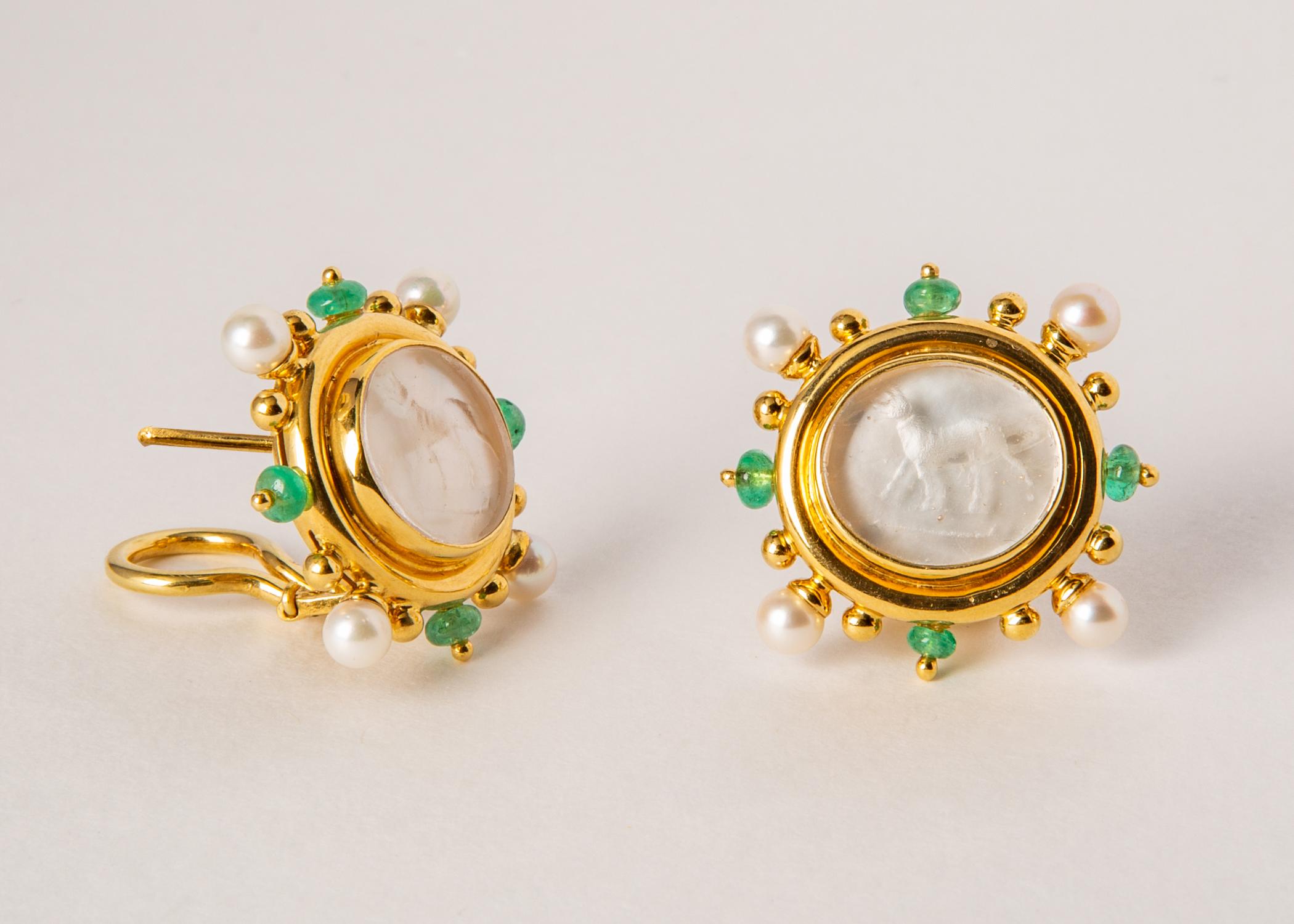 Elizabeth Locke is famous for her Venetian glass intaglios. This exceptional pair of earrings features a regal standing dog Venetian glass intaglio backed with mother of pearl and framed in 18k gold accented with cultured pearls and emerald beads. 