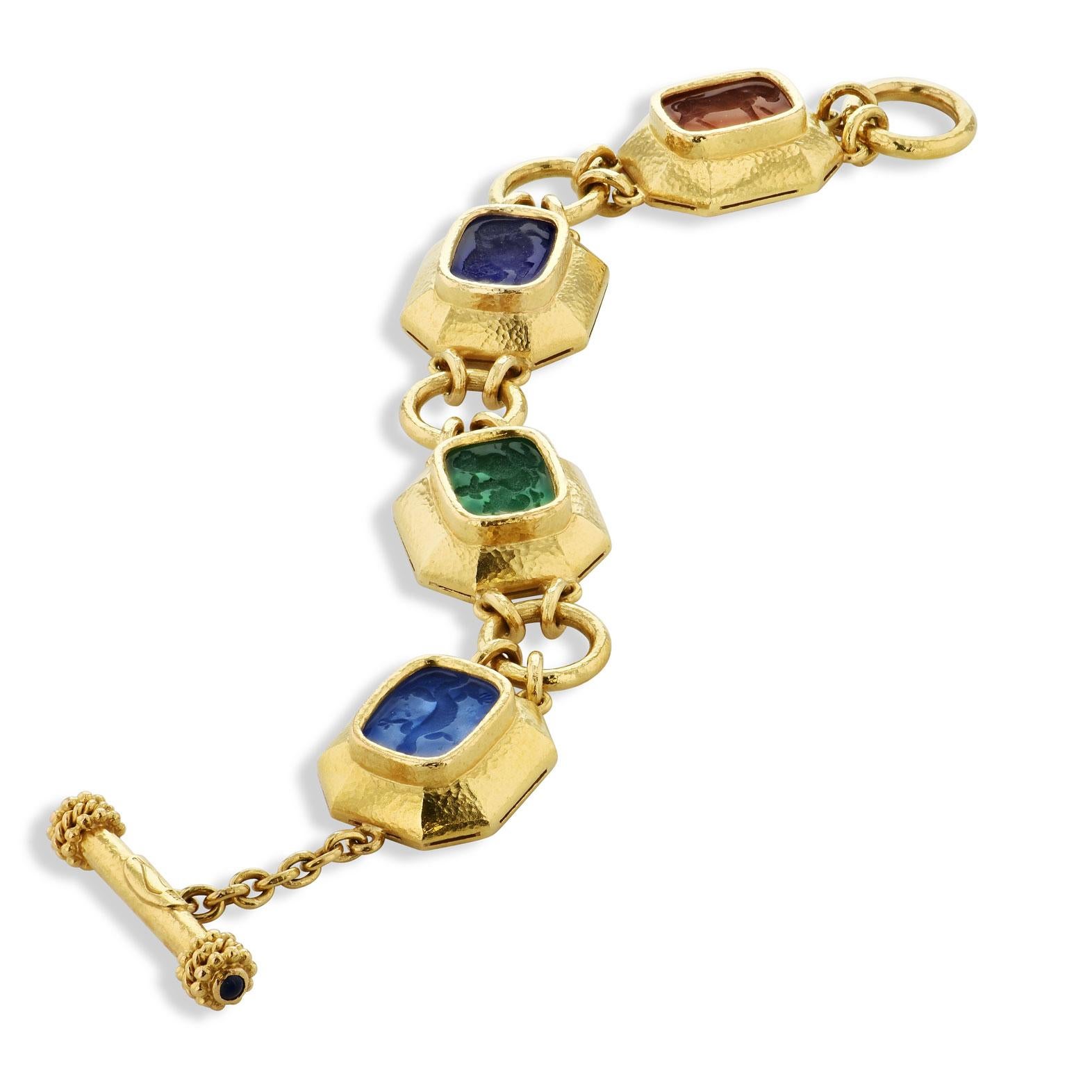 Elizabeth Locke Venetian Glass Animal Intaglio Yellow Gold Toggle Bracelet 19 karat Gold

This previously loved Elizabeth Locke 19 karat yellow gold toggle bracelet features four multi-color intaglio incised antique animals in Venetian glass. Make a