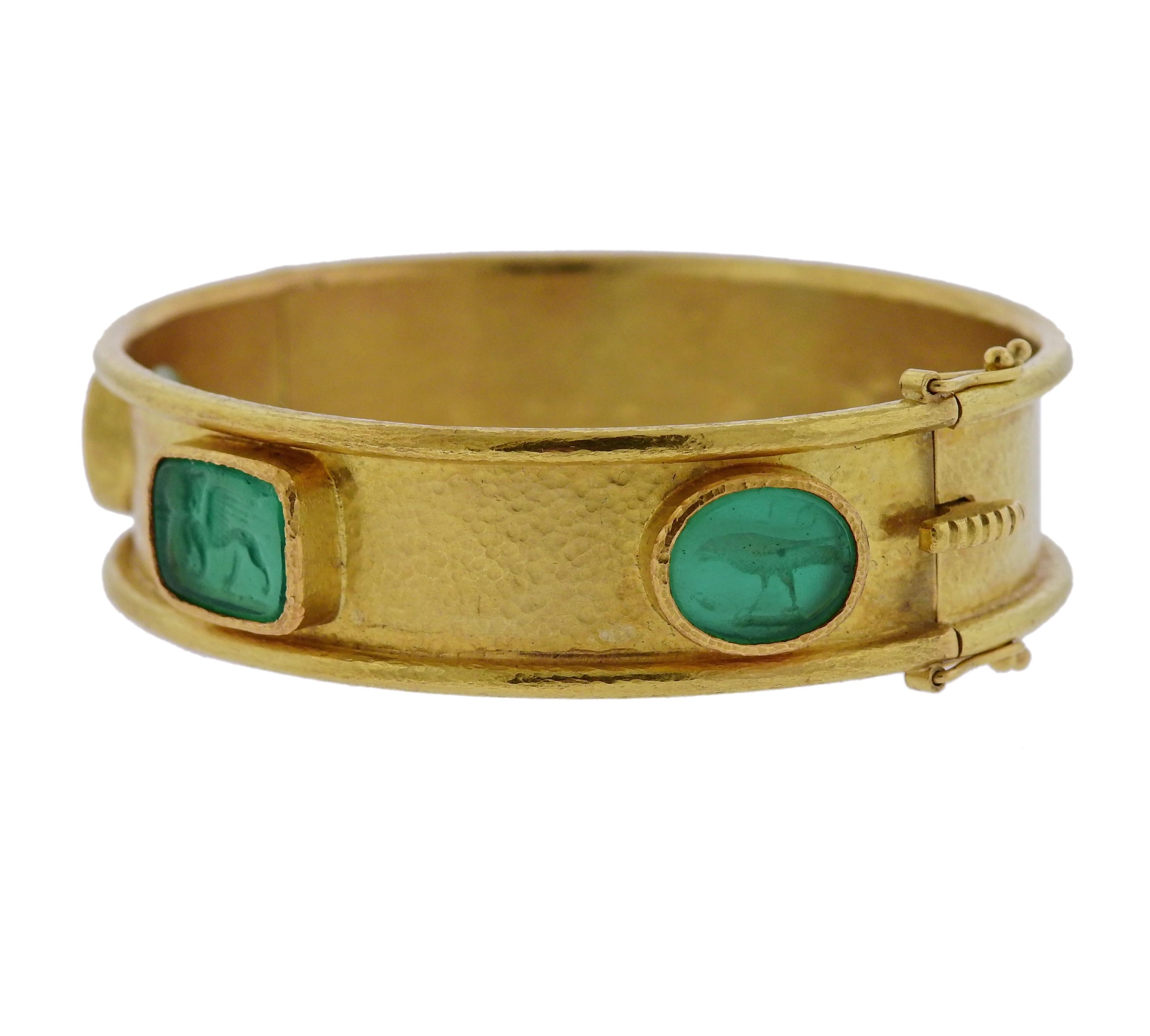 18k gold bangle bracelet, crafted by Elizabeth Locke, set with green Venetian glass intaglio, backed with mother of pearl.  Bracelet will fit up to 7