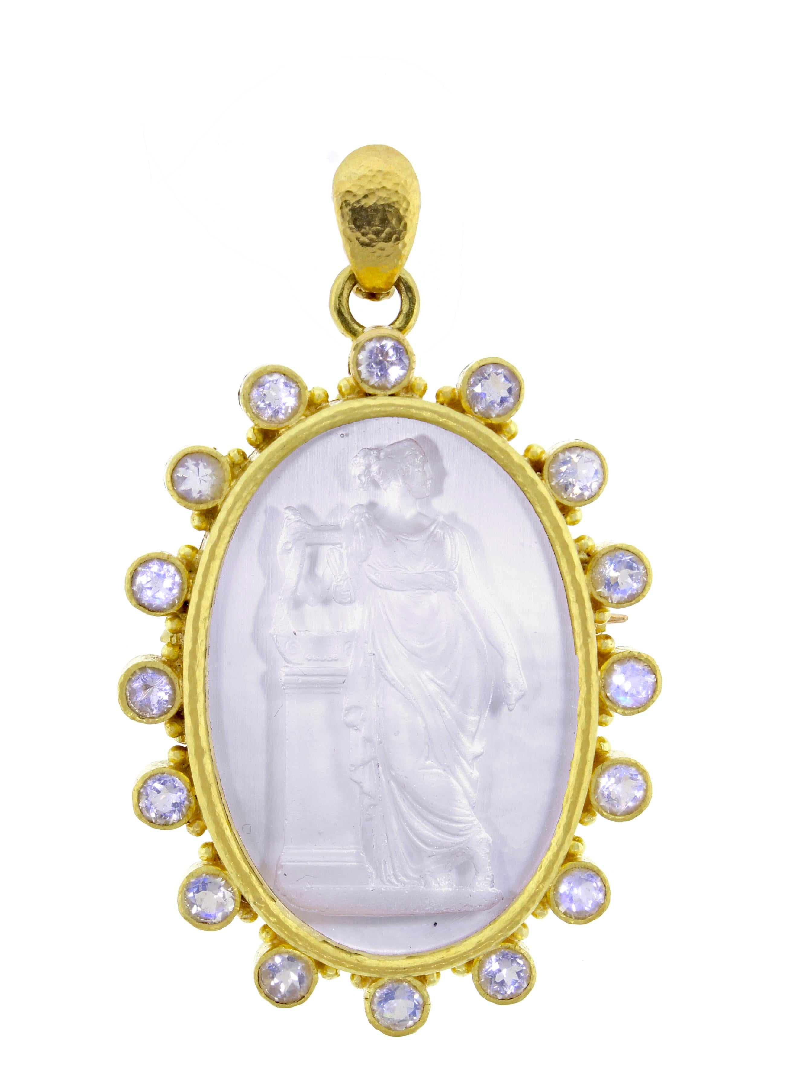 Elizabeth Locke, a  beautifully carved Intaglio of  Venetian glass backed with mother of pearl and framed with faceted moonstone. The  19 karat brooch measures 2 by 1 and 5/8 on an inch.  A removal bail can be used to convert the brooch to a