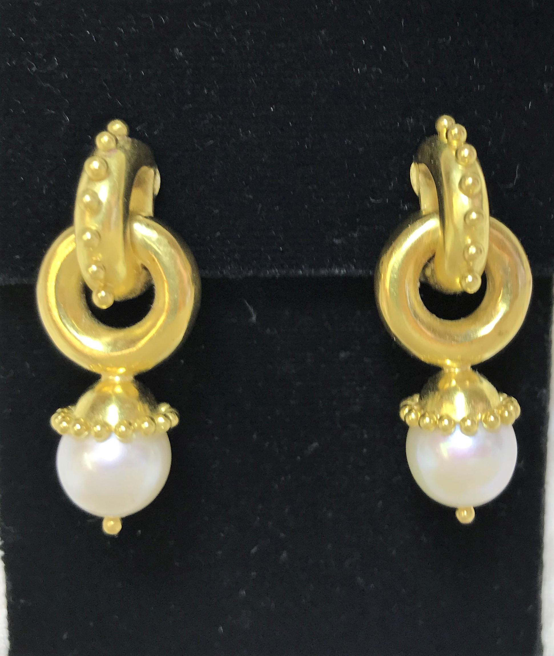 These earrings are a classic must have!
Elizabeth Locke 19 karat yellow gold
White Pearl Cheerio style number ER14728
Pearl is approximately 9mm
19 karat yellow gold hammered finish with granulation with gold dots
Omega clip back with collapsible