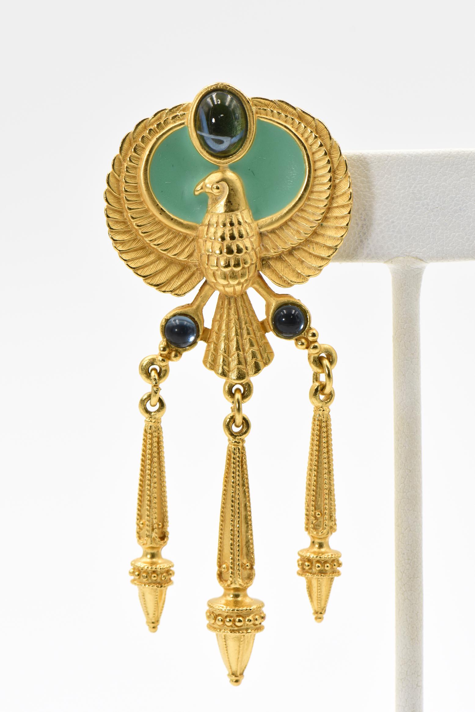 Inspired by the film, Cleopatra, Elizabeth Taylor created the Egyptian Collection for Avon in  1993 .  These magnificent Egyptian falcon clip earrings represent the royal emblem of Cleopatra's reign in the form of right facing falcons.  The falcon