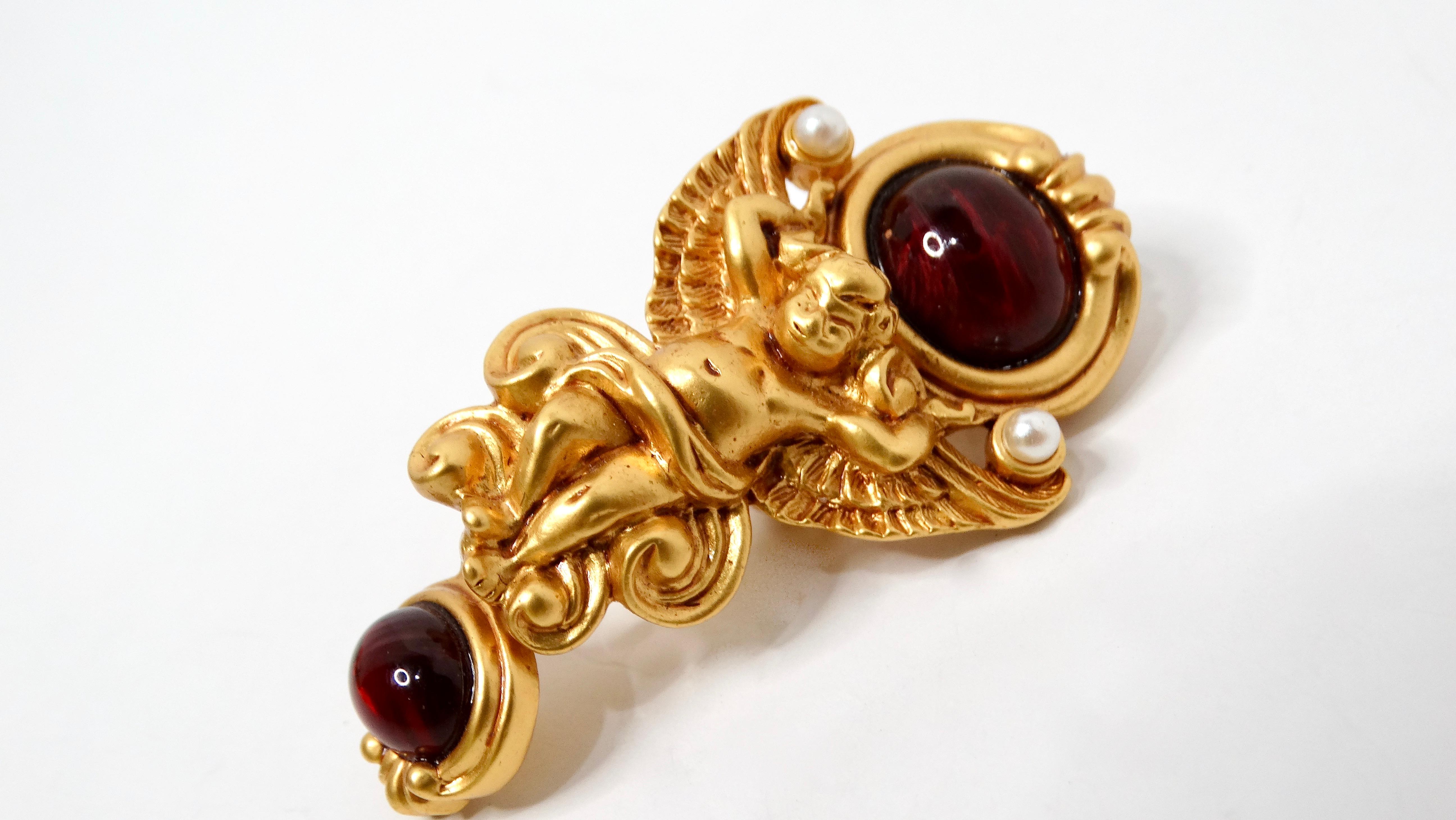 Embrace the timeless elegance of the Elizabeth Taylor for Avon Gilded Age Style Cherub Dangle Clip-On Earrings. These exquisite gold-tone earrings showcase a charming cherub motif, immersing your look in vintage sophistication. Adorned with two