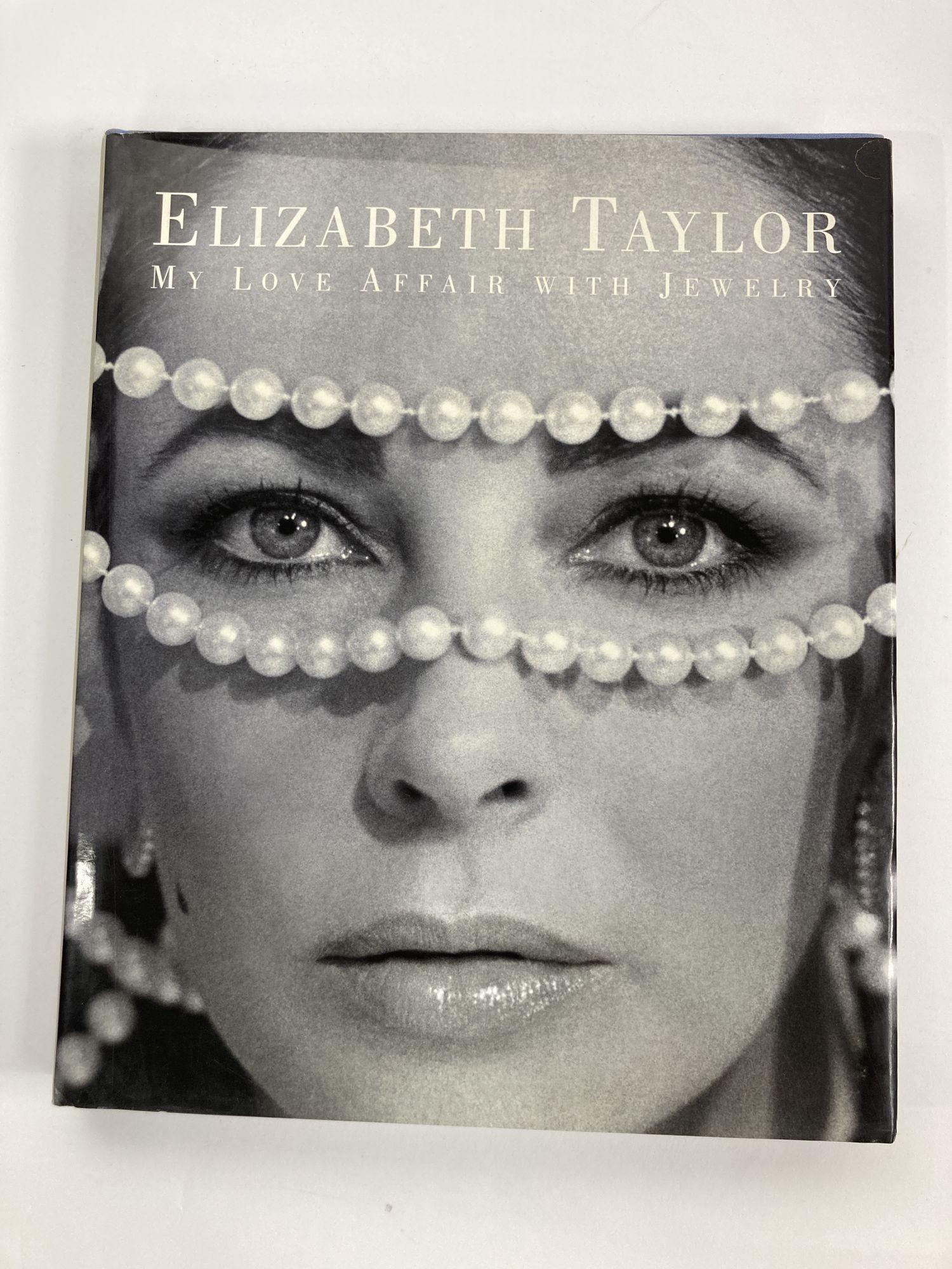 Elizabeth Taylor:my love affair with jewelry 1st edition hardcover book.
Edited by Ruth A. Peltason. 280 illustrations, including 175 color photographs by John Bigelow Taylor.
Dimensions: 10