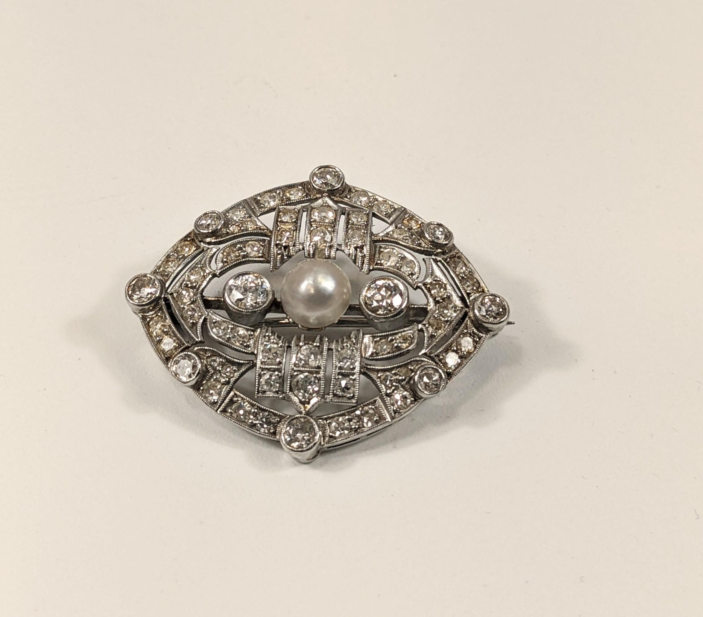 
Elizabethan style platinum brooch with antique cut white diamonds and natural pearl in the center

READY TO SHIP
*Shipment of this piece is not affected by COVID-19. Orders welcome!

MATERIAL
◘ Weight 11,3 grams 
◘ Size 30mm x 35mm / 1,18 x 1,37