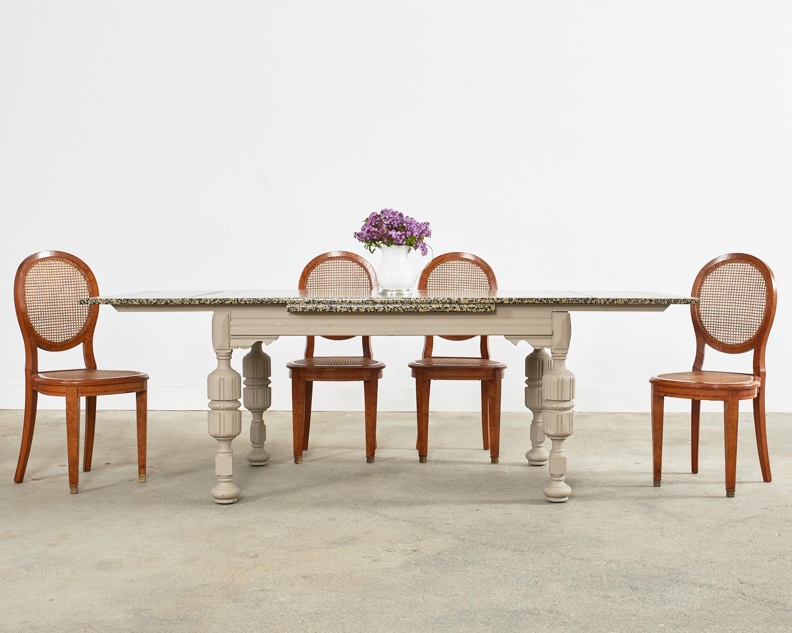 Whimsical English dining table lacquer speckled by artist Ira Yeager (American 1938-2022). The table was crafted in the Elizabethan/Jacobean taste with two large leaves. The leaves have been permanently mounted to the top and do not remove. The top