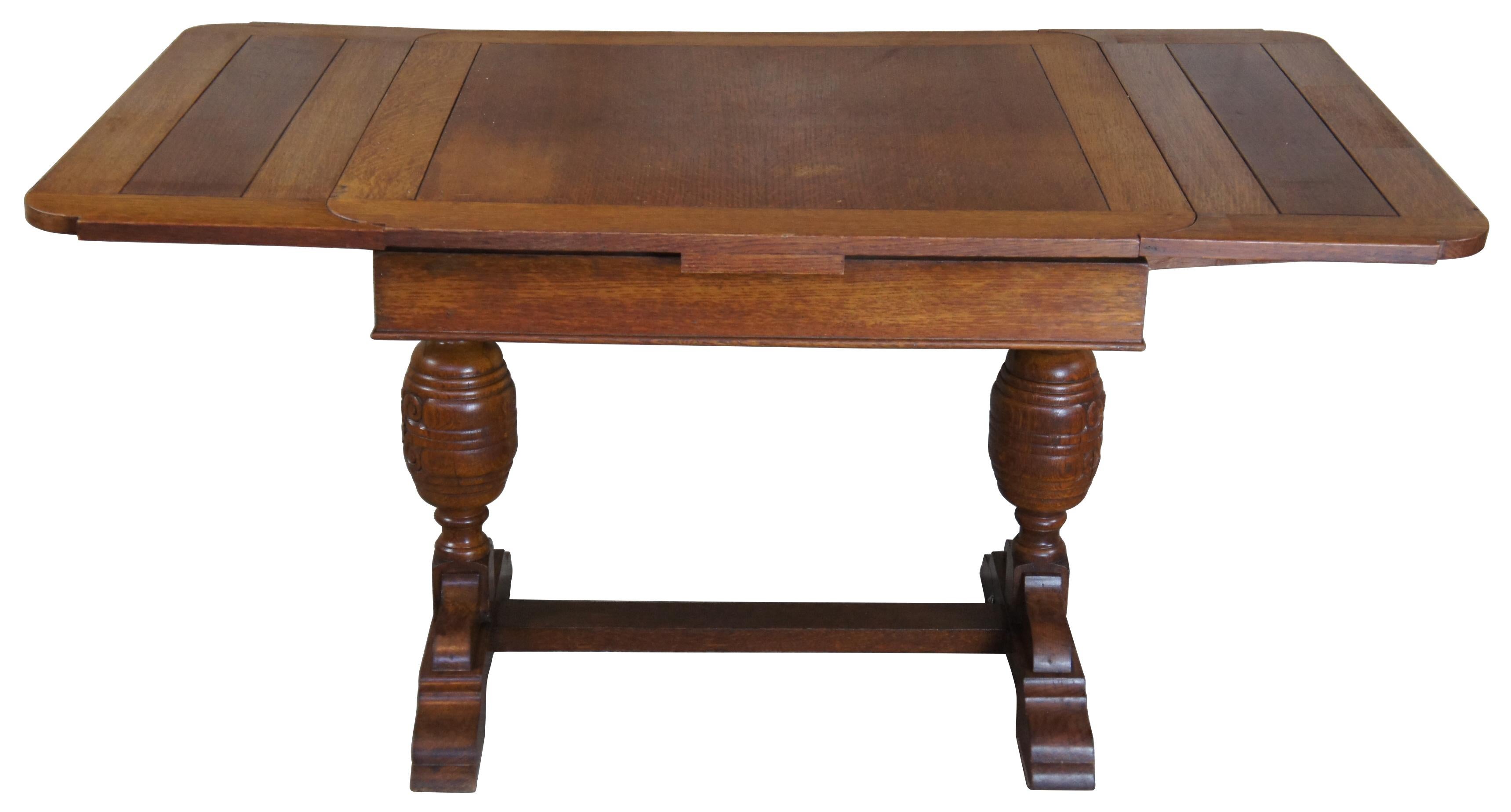 Mid 20th century Elizabethan or Jacobean style oak table. A square form over turned balusters connected by a trestle base. Features two 12