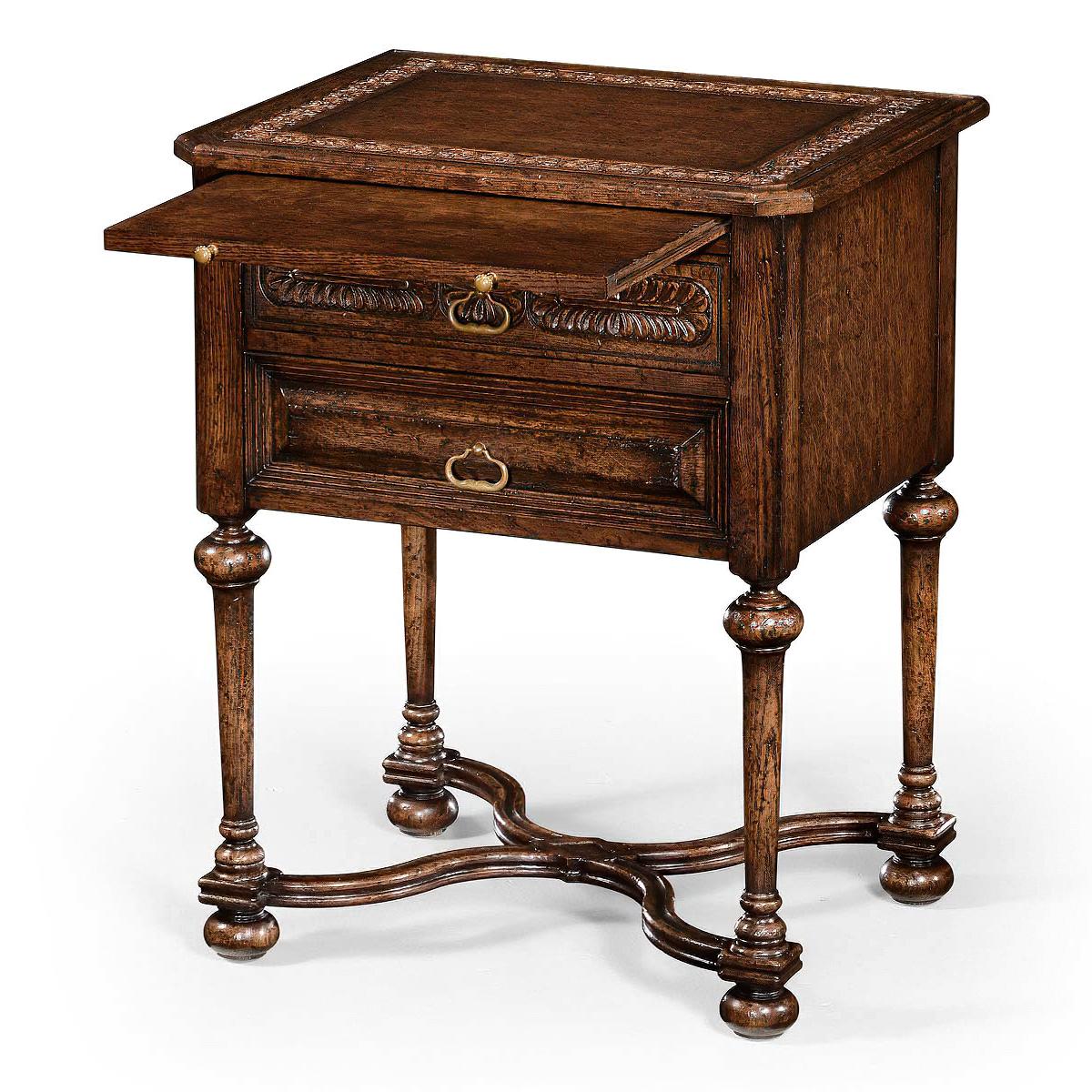 An Elizabethan style oak bedside table, the dark brown oak side table with stepped pyramidal paneled moldings to the two drawer fronts and stylized brass drawer handles. Inset leather panel to top and slide beneath. Turned tapering baluster legs