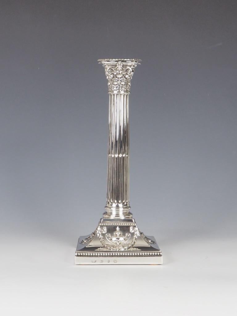 Elkington & Co 1901 Birmingham Sterling Silver Stamped Corinthium Column Candlestick is a stunning piece that will add a touch of elegance to any room.

Crafted by the renowned Elkington & Co in 1901, this candlestick is made of high-quality