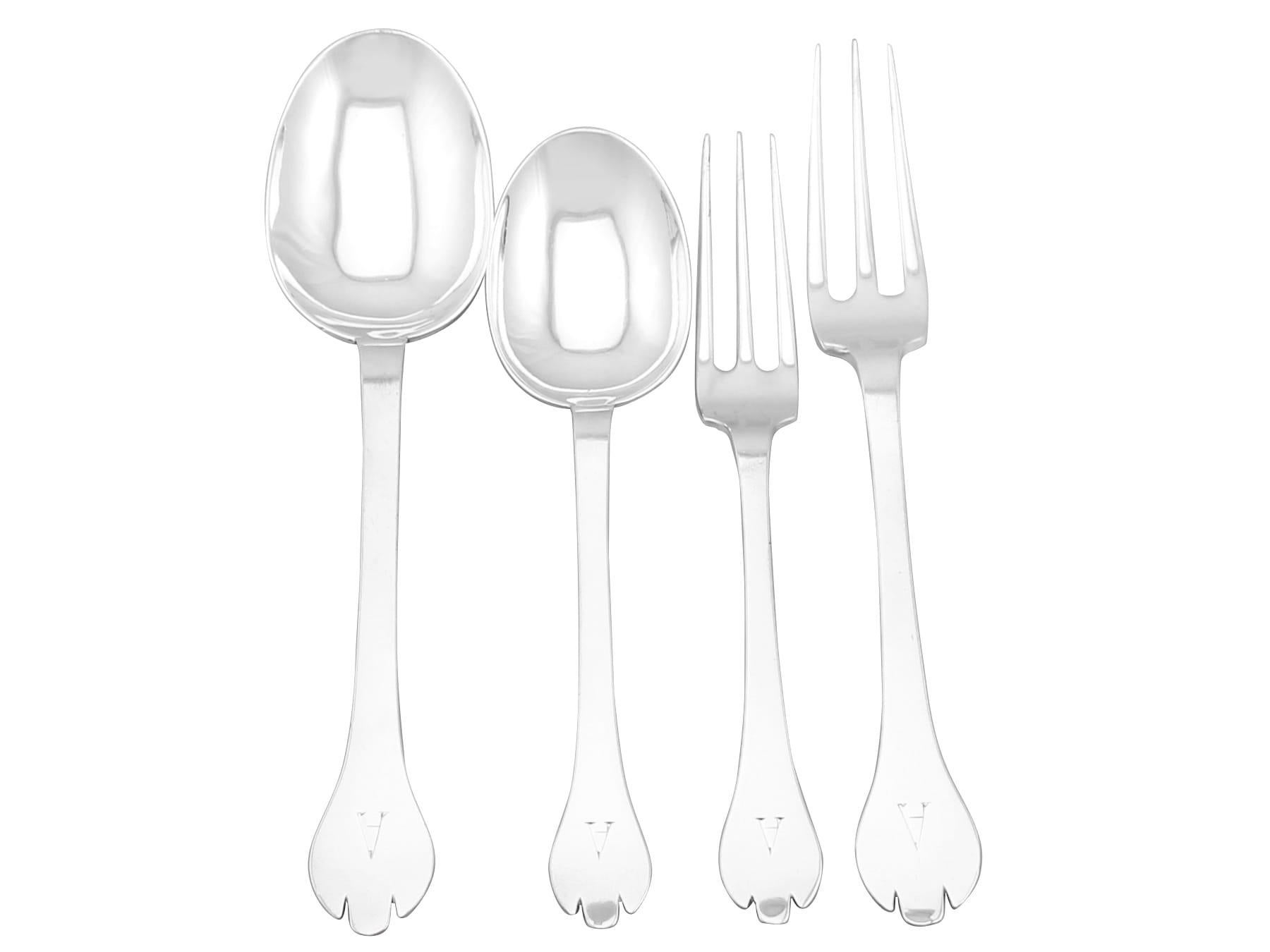 An exceptional, fine and impressive antique George V English sterling silver straight Trefid pattern flatware service for ten persons; an addition to our antique flatware sets

The pieces of this exceptional antique George V sterling silver 10