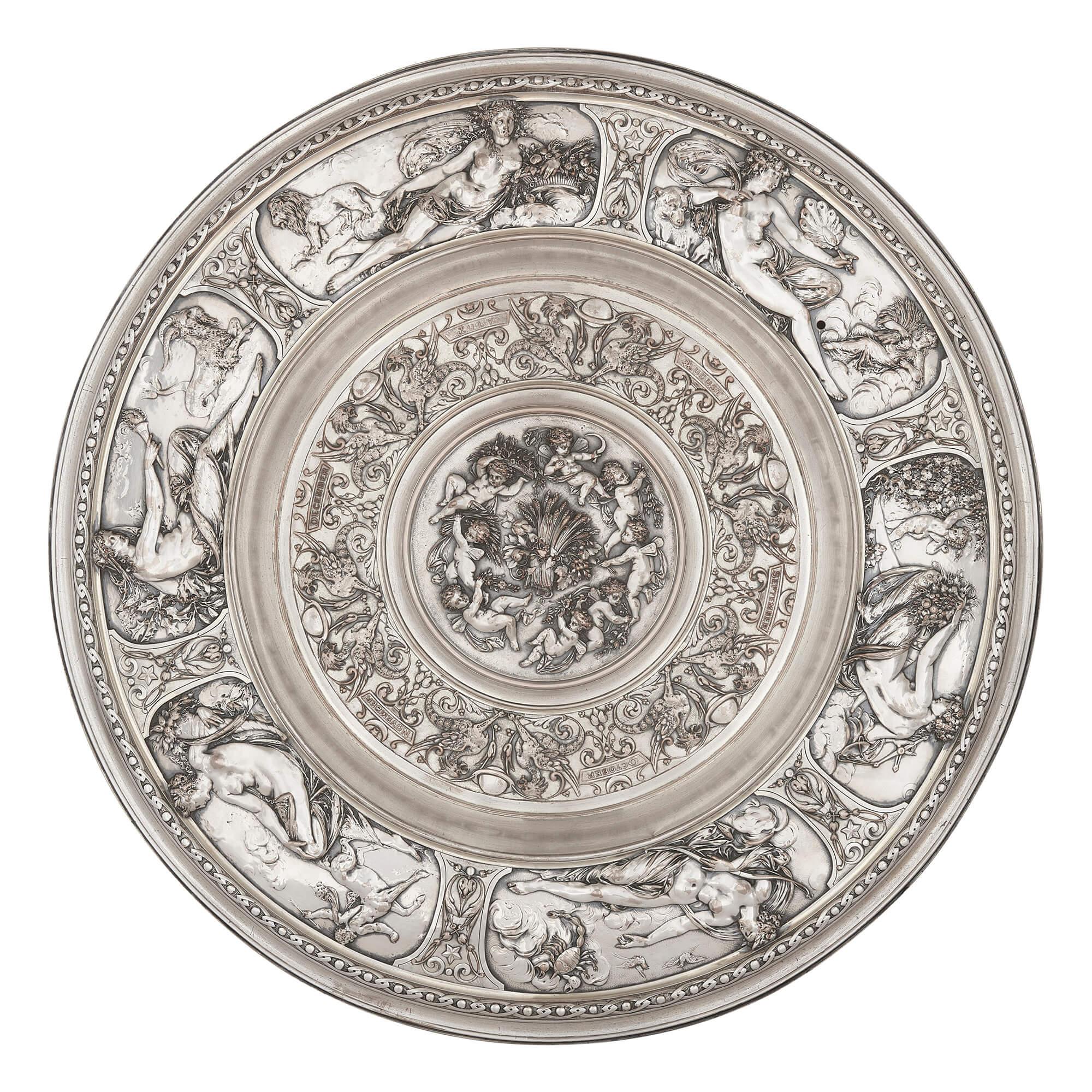 Elkington & Co. pair of silver-plated chargers of The Seasons
English, circa 1870
Height 4cm, diameter 54cm

These exquisite decorative silver-plated, or electrotype, chargers were manufactured by the highly renowned Victorian silversmiths,