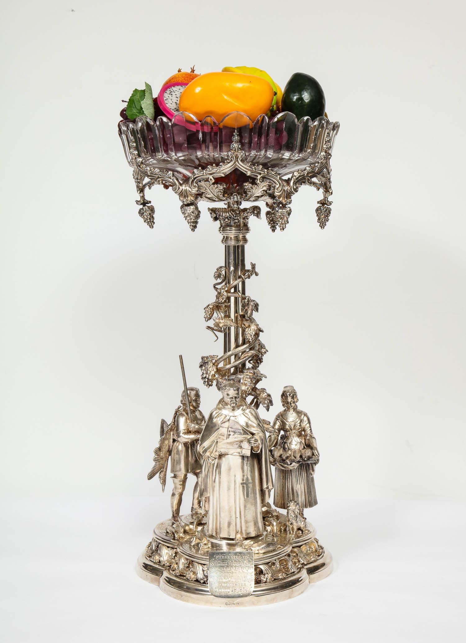 Elkington Mason & Co. A rare, important, and historic silvered bronze centerpiece,
with original cut-glass bowl.

Victorian period, dated 1859, Birmingham, hallmarked to the base.

This centerpiece is made of exquisite craftsmanship and quality. The