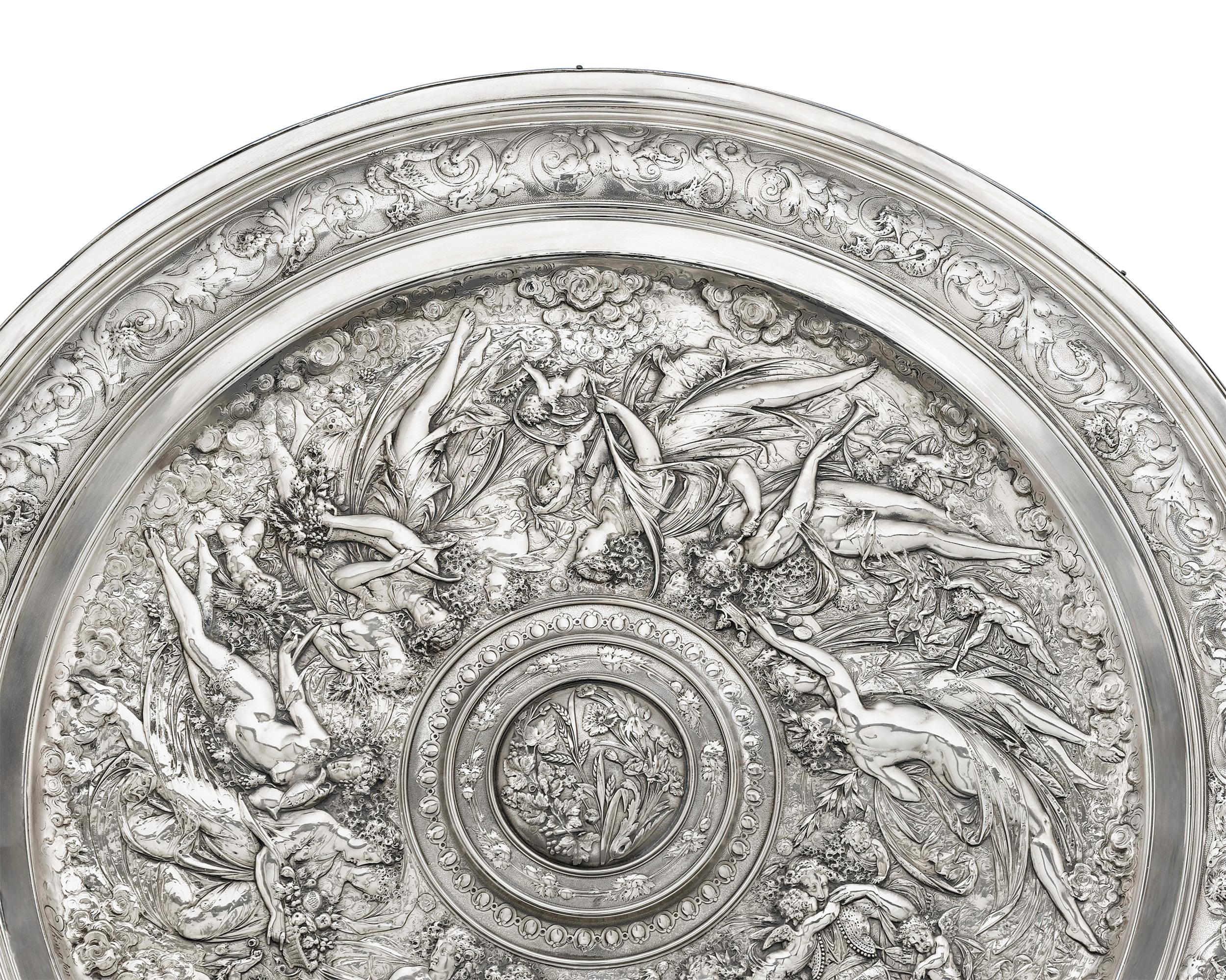 This highly important silver plate charger modelled by French artist Léonard Morel-Ladeuil is based on the sculptor's original design for a wedding gift to the prince and princess of Wales. The exquisite piece was cast by the legendary Elkington &