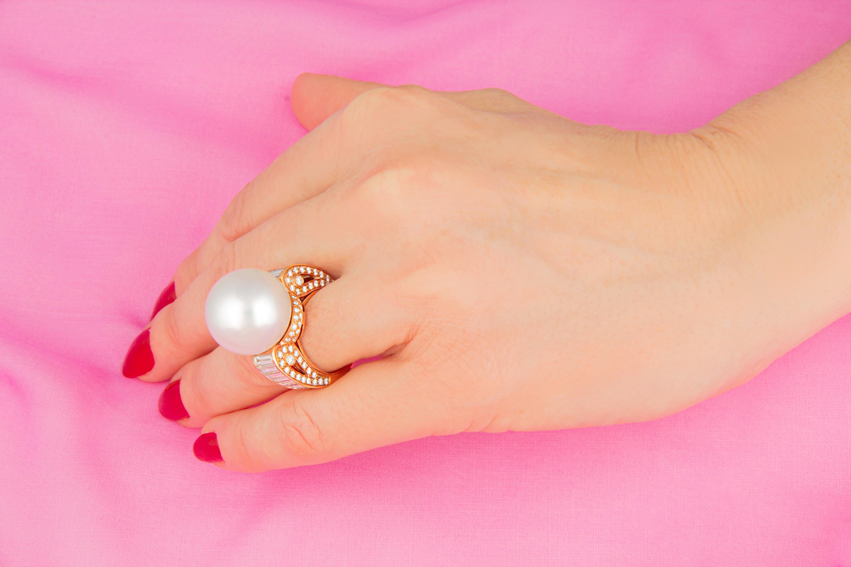 This South Sea pearl and diamond cocktail ring features a gem quality South Sea pearl of the extraordinary size of 18.5mm diameter and pinkish hues. The pearl is untreated. It displays a splendid nacre and its natural color and luster have not been