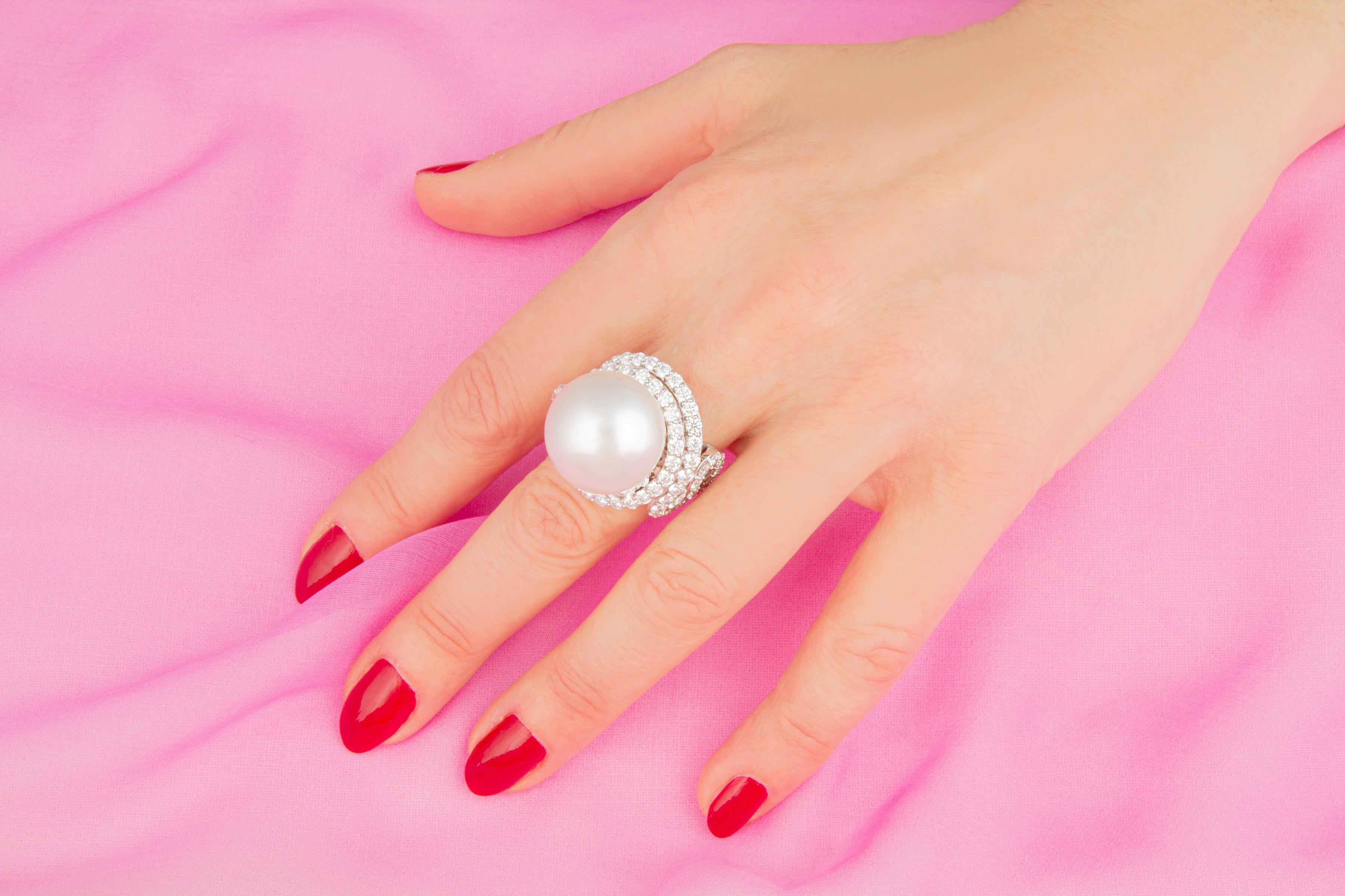 This South Sea pearl and diamond cocktail ring features a gem quality pearl of the extraordinary size of 19mm diameter. The pearl is untreated. It displays a splendid nacre and its natural color and luster have not been enhanced in any way. The