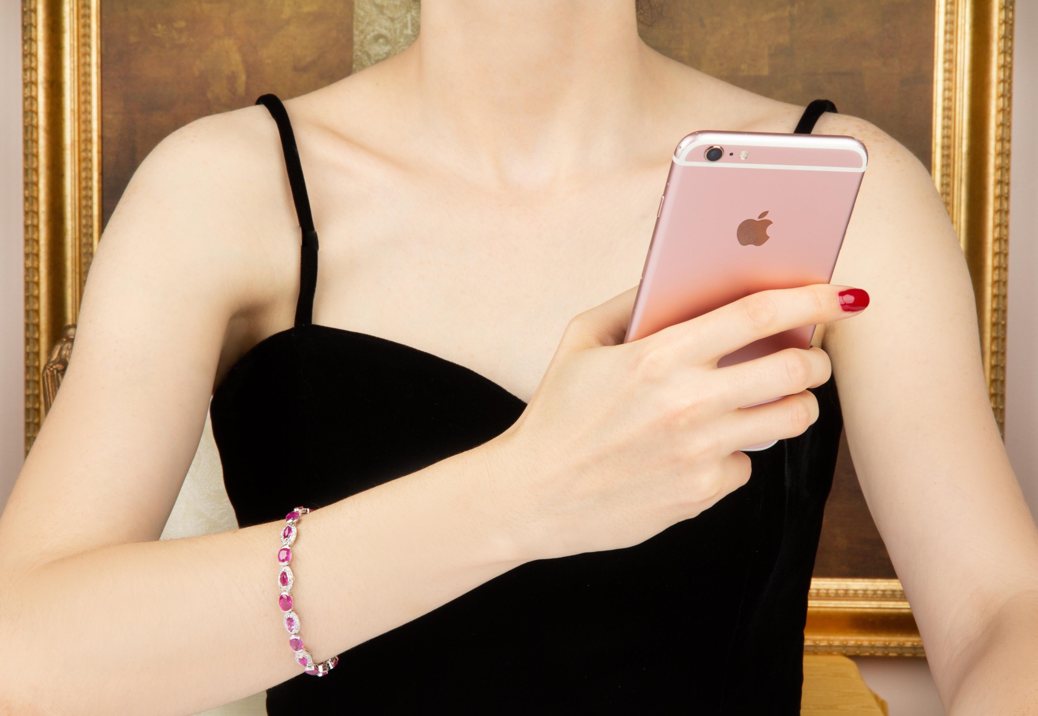 The pink sapphire and diamond bracelet features oval cut and marquise shape faceted sapphires of brilliant hues and crystalline texture for a total of 18.20 carats. The design is complete with bridges set with 1 carat of top quality diamonds