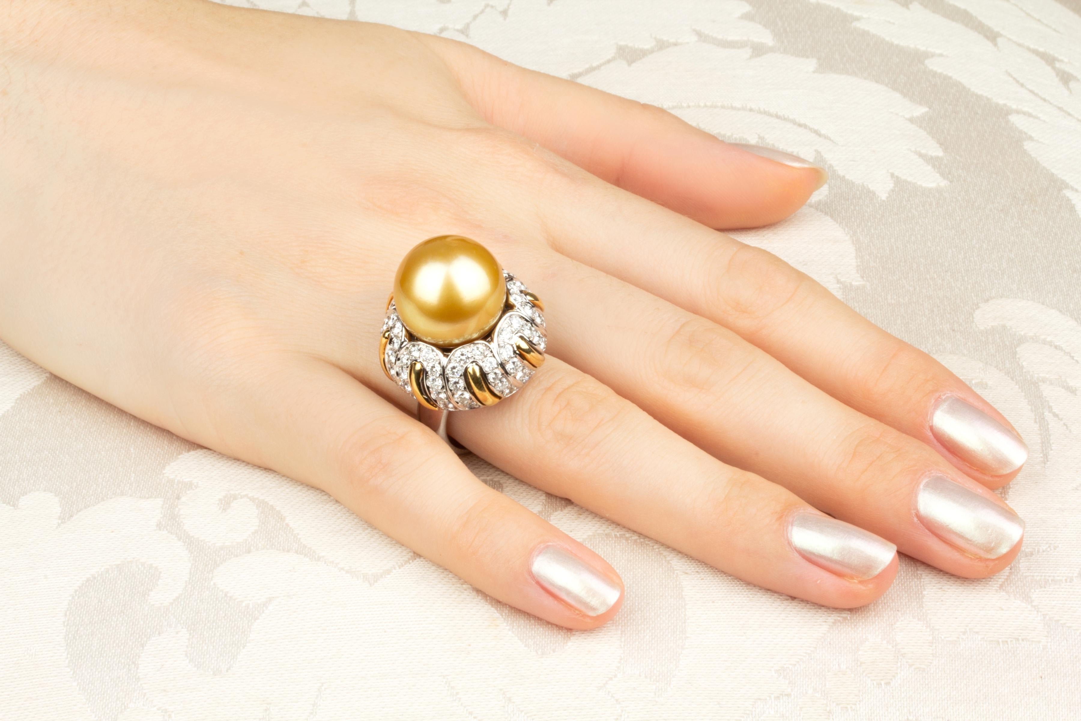 This pearl and diamond ring features a splendid pearl of 16mm diameter. The pearl is untreated. It displays fine nacre and its natural color and luster have not been enhanced in any way. The pearl is perched on a crown of 2.60 carats of round