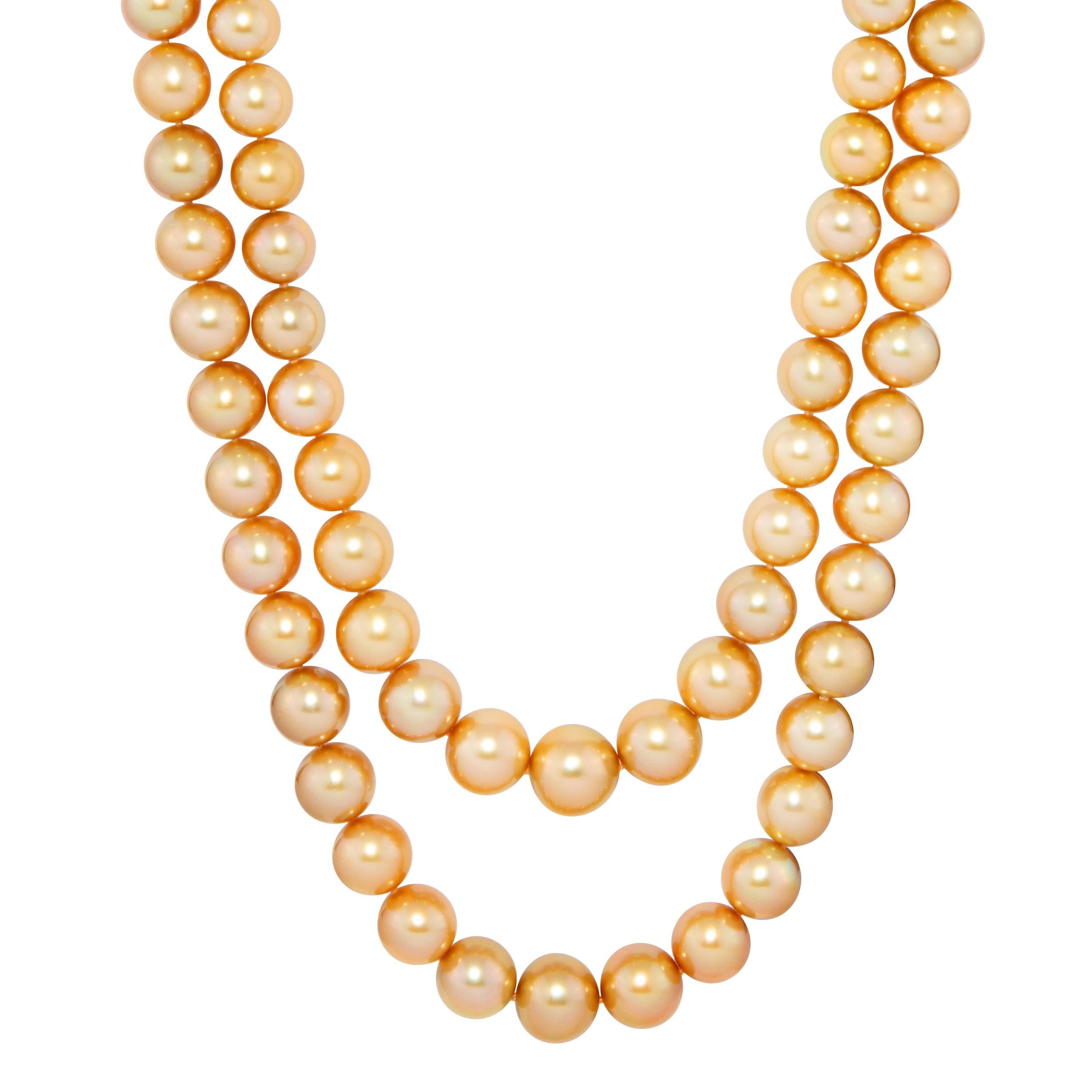 This opera length double strand South Sea golden pearl necklace is constituted by 2 individual strands.  One strand features 59 pearls measuring from 16mm to 12mm in diameter, for a length of 30”. The slightly longer strand features 63 pearls