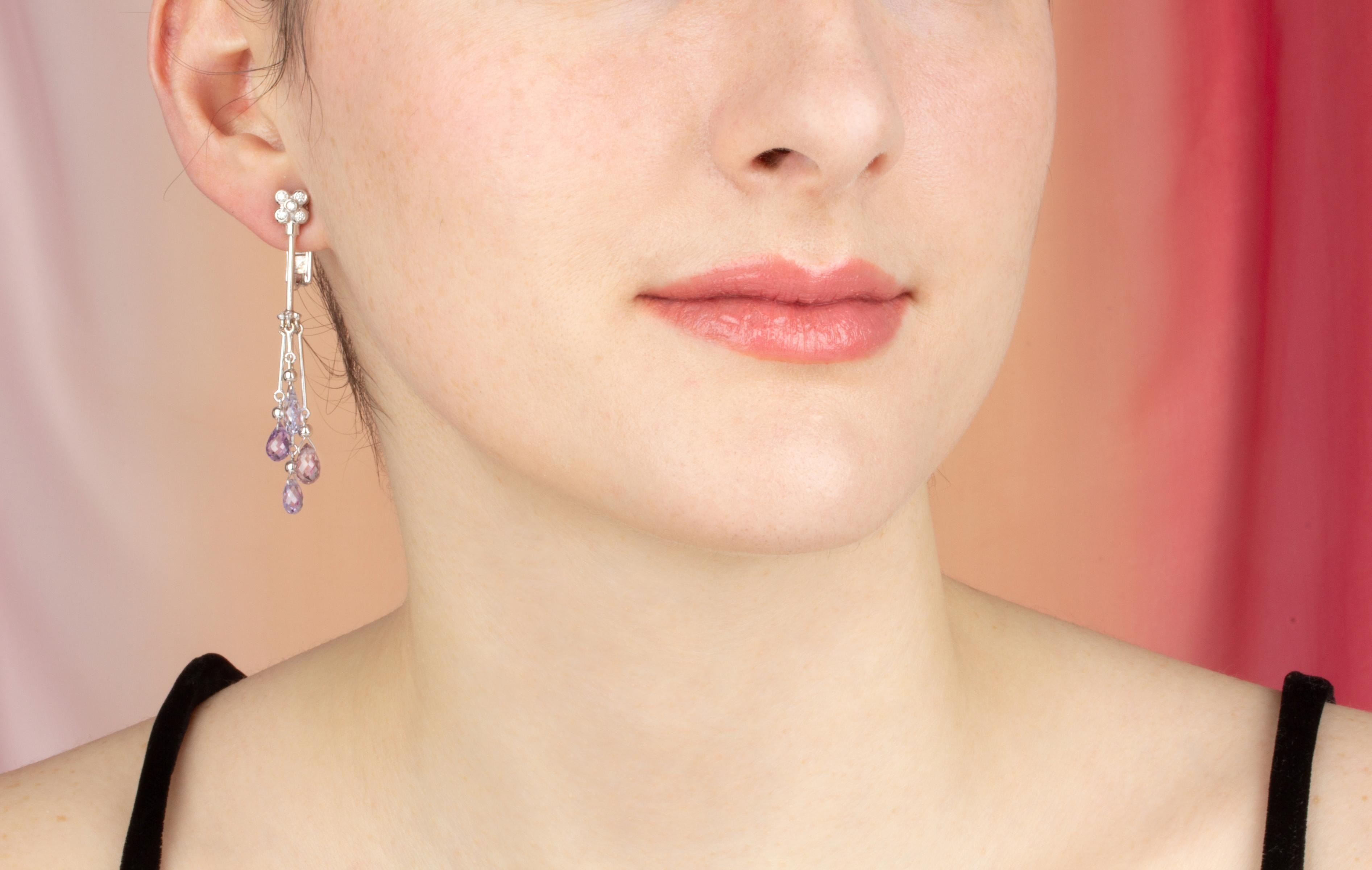 These multicolor sapphire and diamond drop earrings feature 8 briolette sapphires of lavender hues for a total of approximately 10 carats in a playful and flexible design. The earring is complete with 0.30 carats of round diamonds of top quality