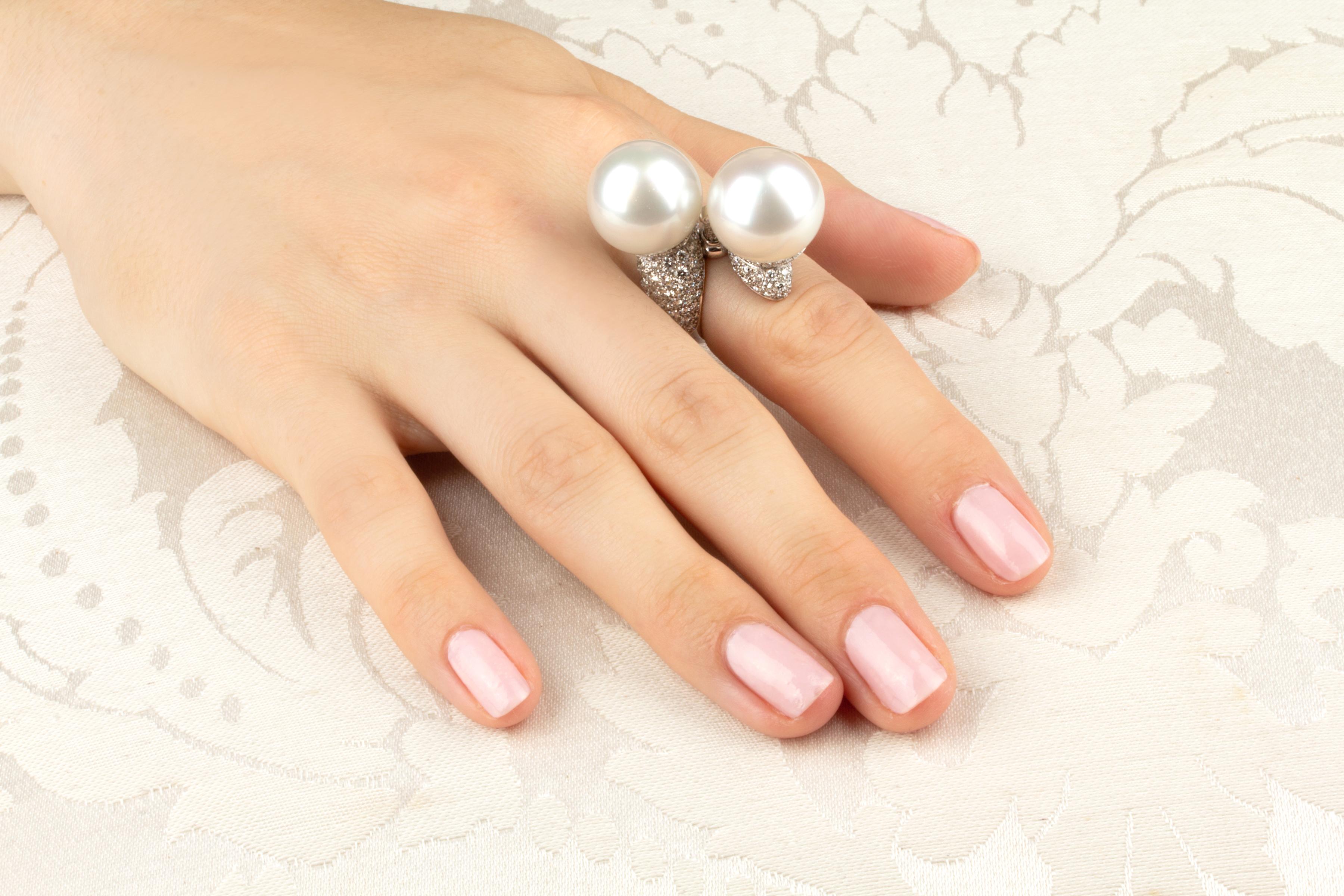 The zodiac Libra ring features two finely matched pearls of 15.5mm diameter. The pearls are untreated. They both display a splendid nacre and their natural color and luster have not been enhanced in any way. Each pearl is perched on top of a crown