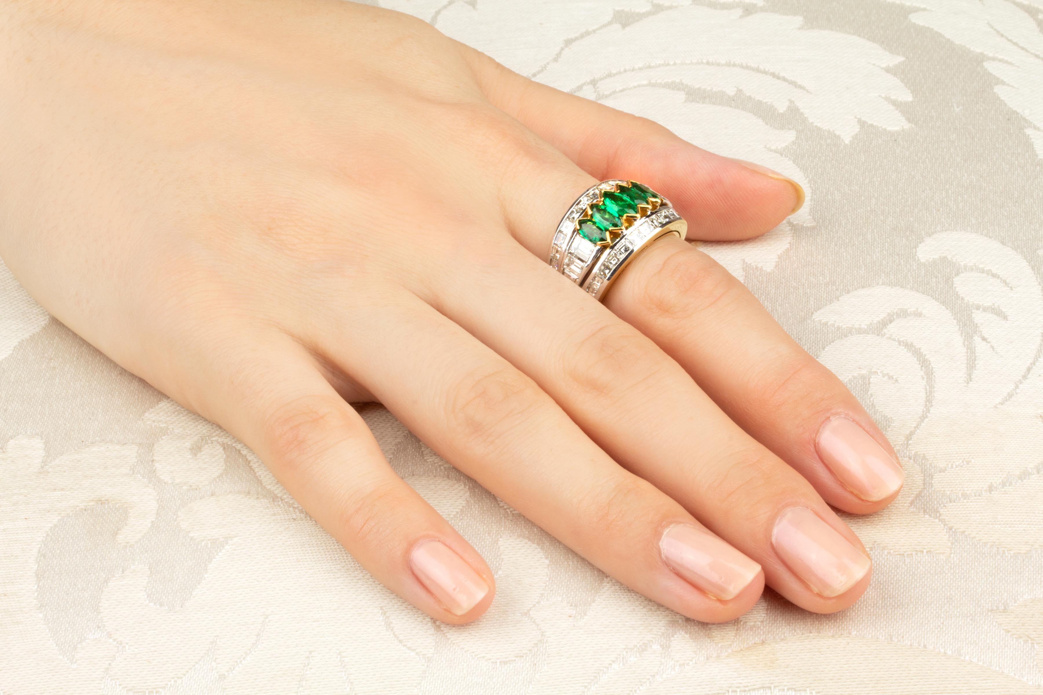 The ring features a central row of symmetrically graduated marquise-cut Zambian emeralds (1.18 carats) flanked by 2 rows of baguette diamonds (2.96 carats). All our diamonds are of top quality (color, clarity and cut, F/G-VVS).
The ring was entirely