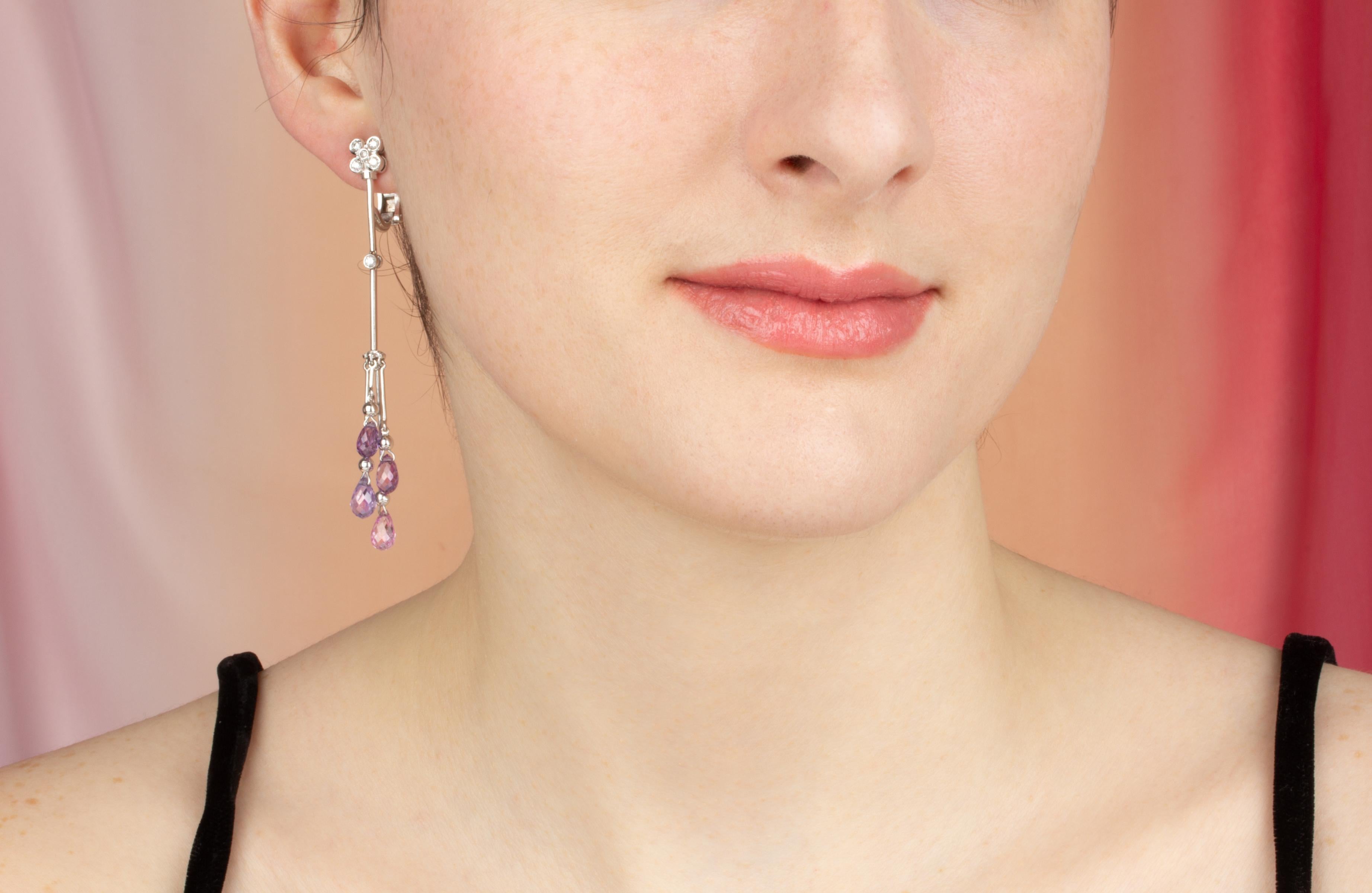 These multicolor sapphire and diamond drop earrings feature 8 briolette sapphires of different colors for a total of approximately 11 carats in a playful and flexible design. The earring is complete with 0.30 carats of round diamonds of top quality
