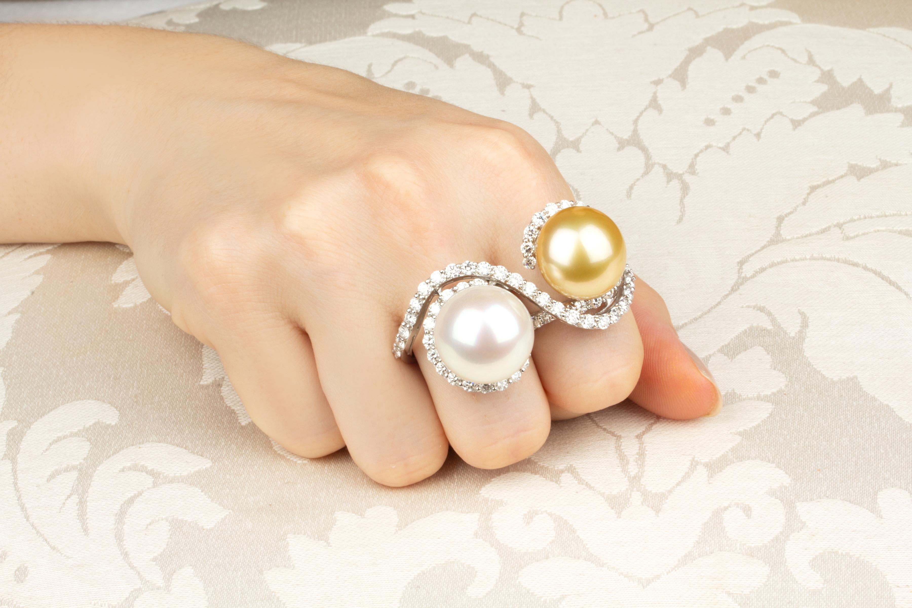 This two-finger pearl and diamond ring features a splendid Australian South Sea pearl and an equally splendid golden pearl, both of 17mm diameter. The untreated pearls display a fine quality nacre and their natural color and luster have not been