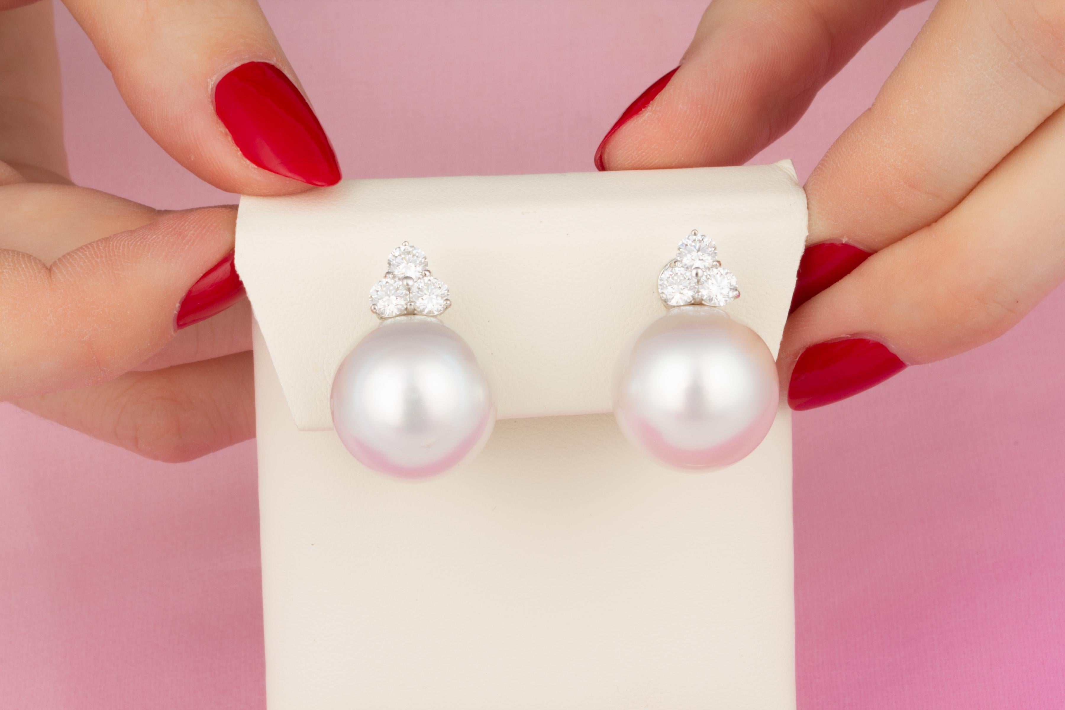 This pair of earrings features two very large and splendid South Sea pearls of 17.5mm diameter with a diamond design.
The untreated South Sea pearls originate from the waters of Northwestern Australia. They display a lovely nacre and their natural
