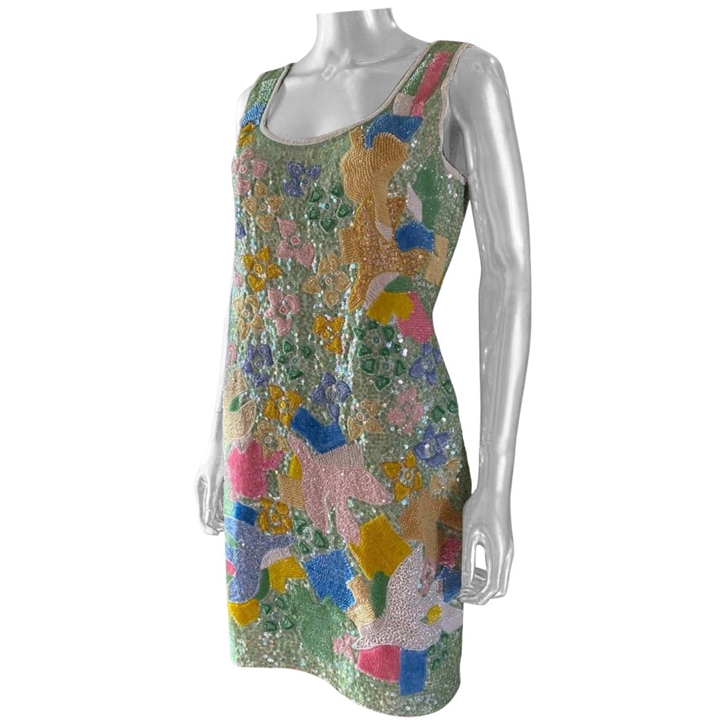 Questo abito in edizione limitata è stato realizzato per Escada dalla bravissima Ella Singh. Ha disegnato e realizzato una collezione di abiti con intricate perline per Escada, in Germania. Solo in India si possono realizzare decorazioni così