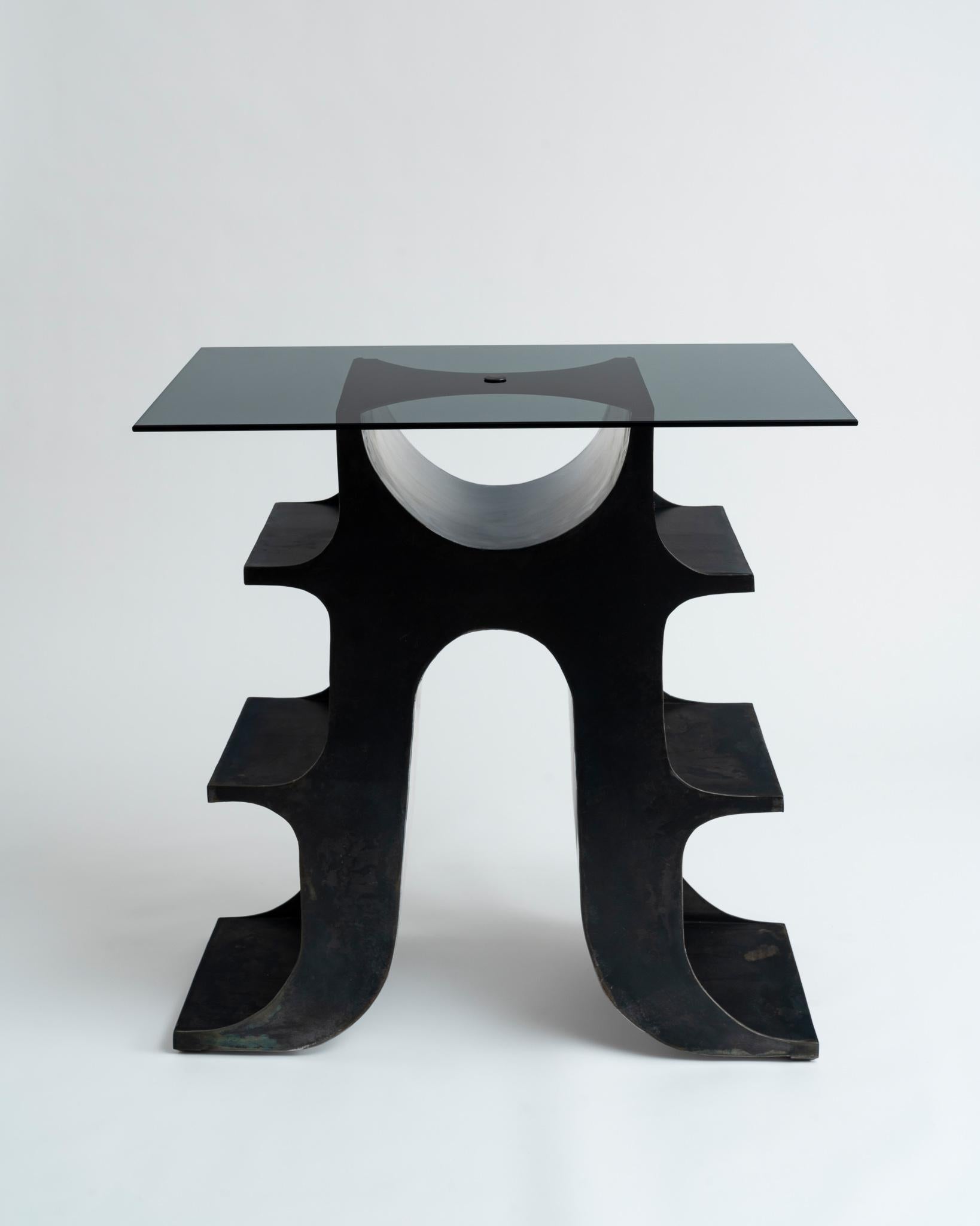 Sculptural blackened steel and smoked glass top console table or standing desk by New York-based artist and designer Ellen Pong. Entitled 