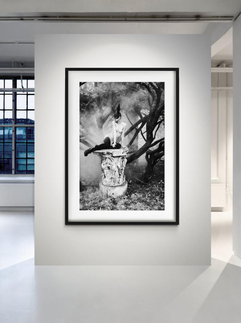 Bunny on pedestal - nude model with bunny ears - Photograph by Ellen von Unwerth