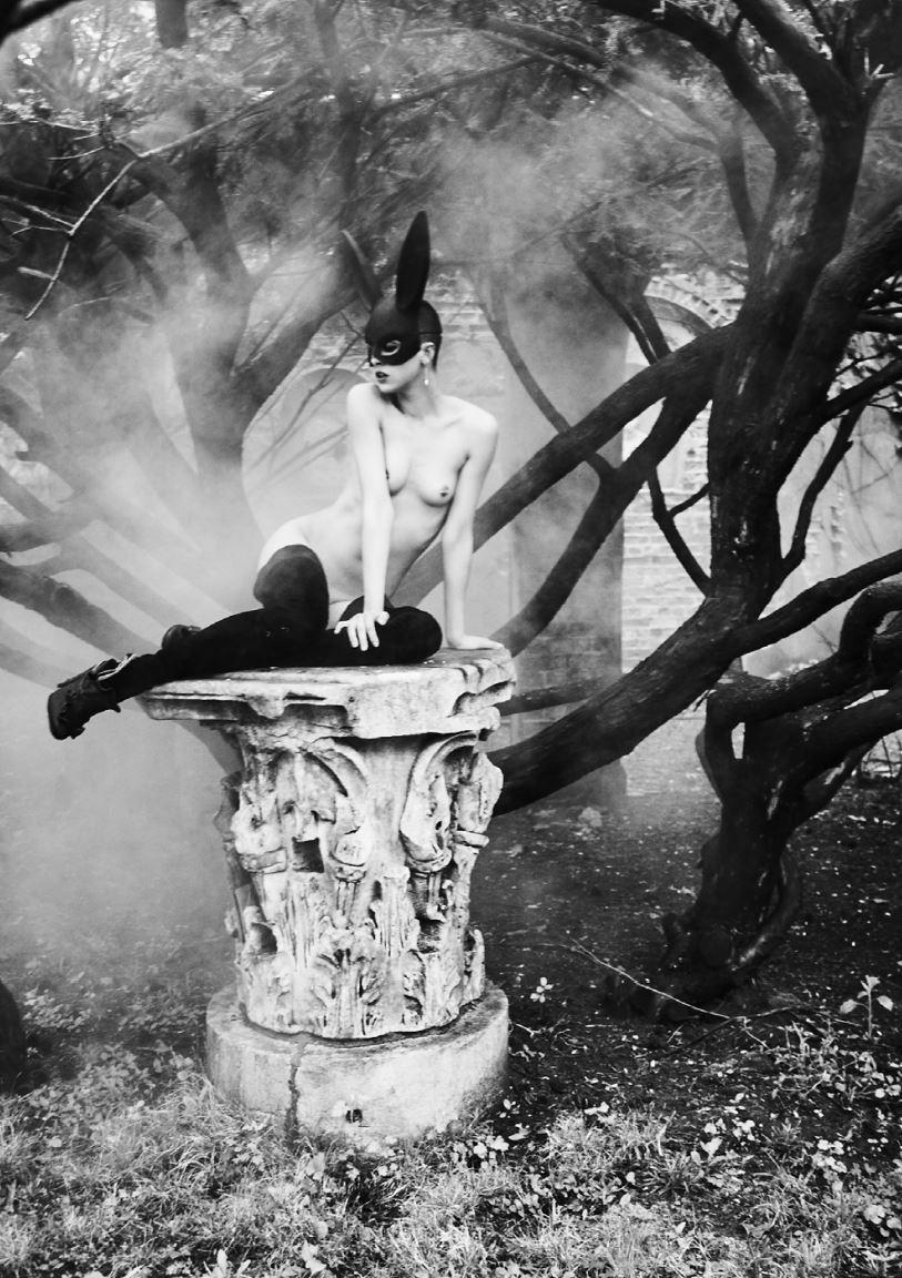 Ellen von Unwerth Black and White Photograph - Bunny on pedestal - nude model with bunny ears