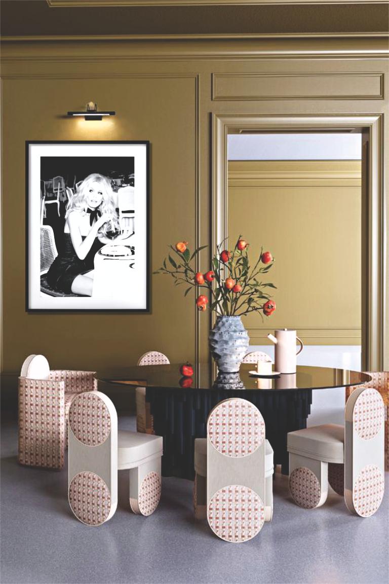 Claudia Schiffer in a jeans dress, sitting in a restaurant with a glass of wine. Photographed by Ellen von Unwerth for the 'Guess 30th Anniversary' Campaign in 2012.

All prints are limited edition. Available in multiple sizes. High-end framing on