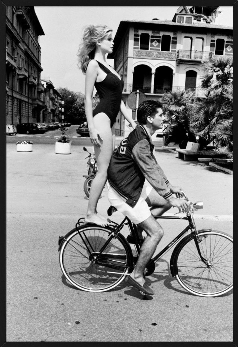 Claudia Schiffer in a black bathing suit, standing on the back of a bike. Photographed by Ellen von Unwerth for Guess in Pisa in 1989.

All prints are limited edition. Available in multiple sizes. High-end framing on request.

All prints are done