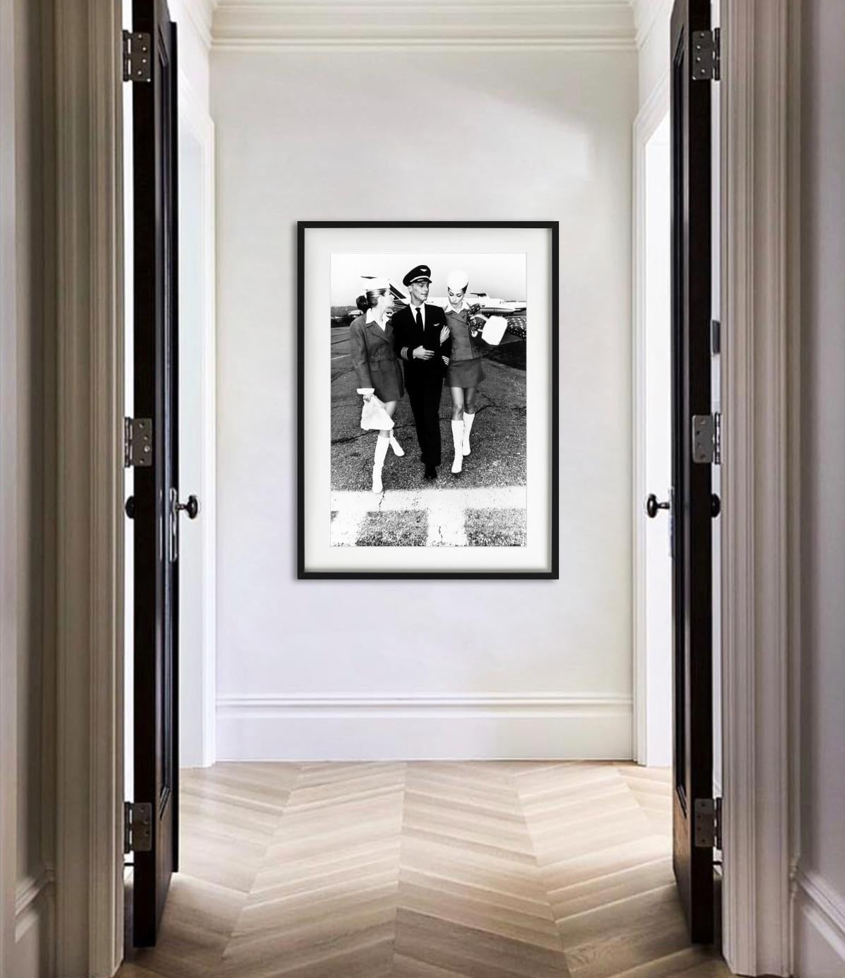 Fashion Airlines 4 - Carla Bruni Catches A Flight In Style, Fine Art Photography - Black Black and White Photograph by Ellen von Unwerth