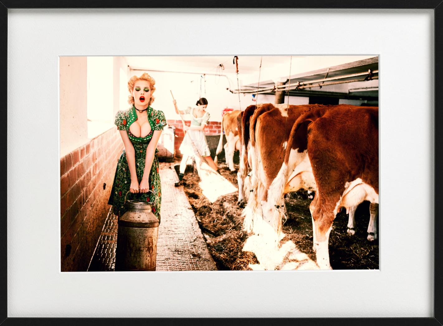 Heavy Duty -  Girl carrying Milk through cows stabel, fine art photograhpy, 2015 - Orange Figurative Photograph by Ellen von Unwerth
