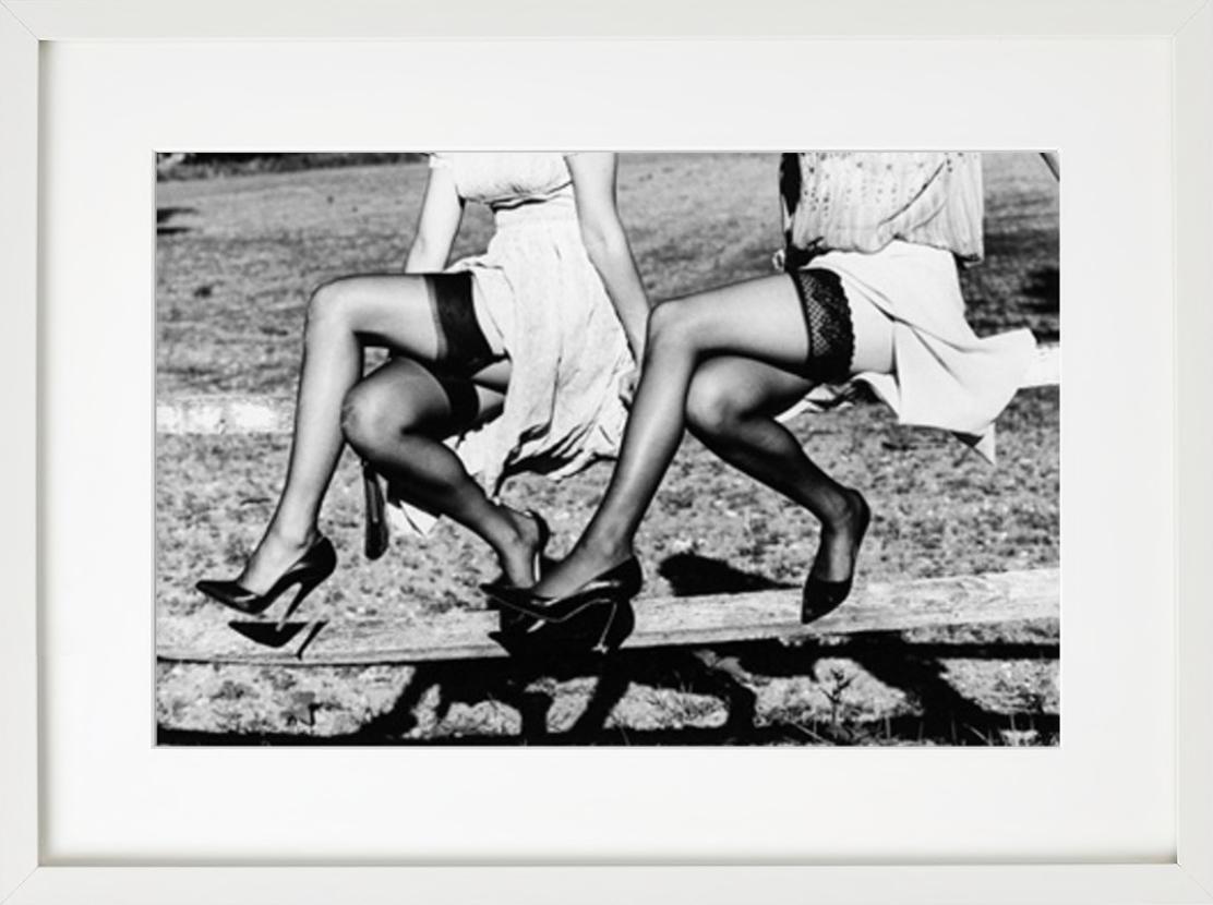 Leg Show II - Models in Stockings sitting on a fence, fine art photography, 2002 - Contemporary Photograph by Ellen von Unwerth