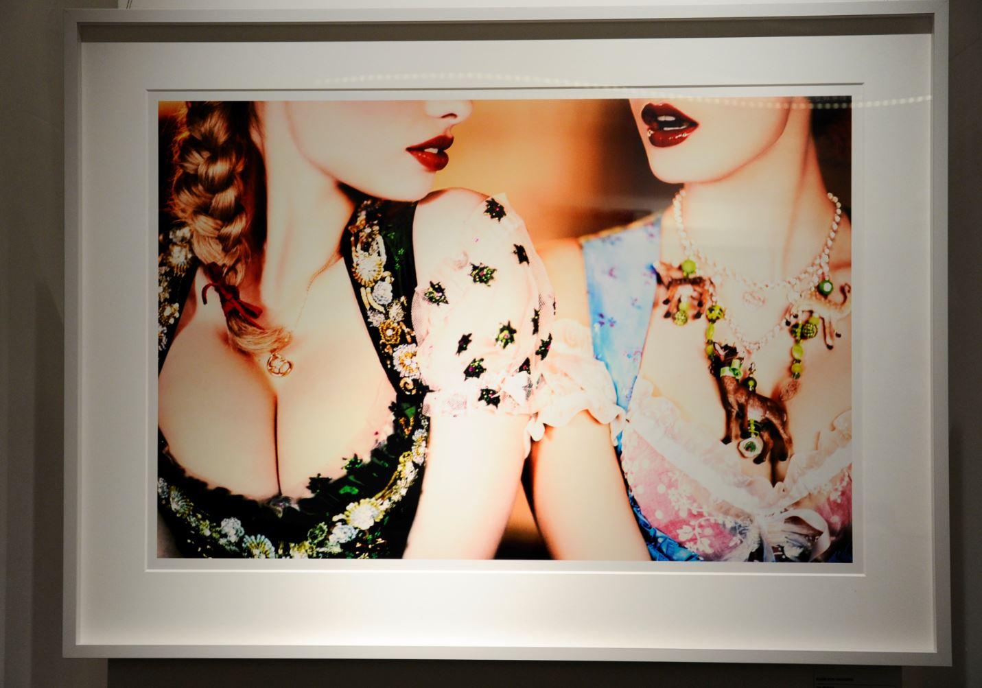 Necklace - portrait of two models showing cleavage in traditional Bavarian dress - Photograph by Ellen von Unwerth