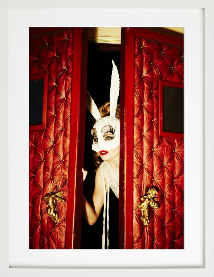 Peeking Bunny - model with bunny mask through door, fine art photography, 2012 - Contemporary Photograph by Ellen von Unwerth