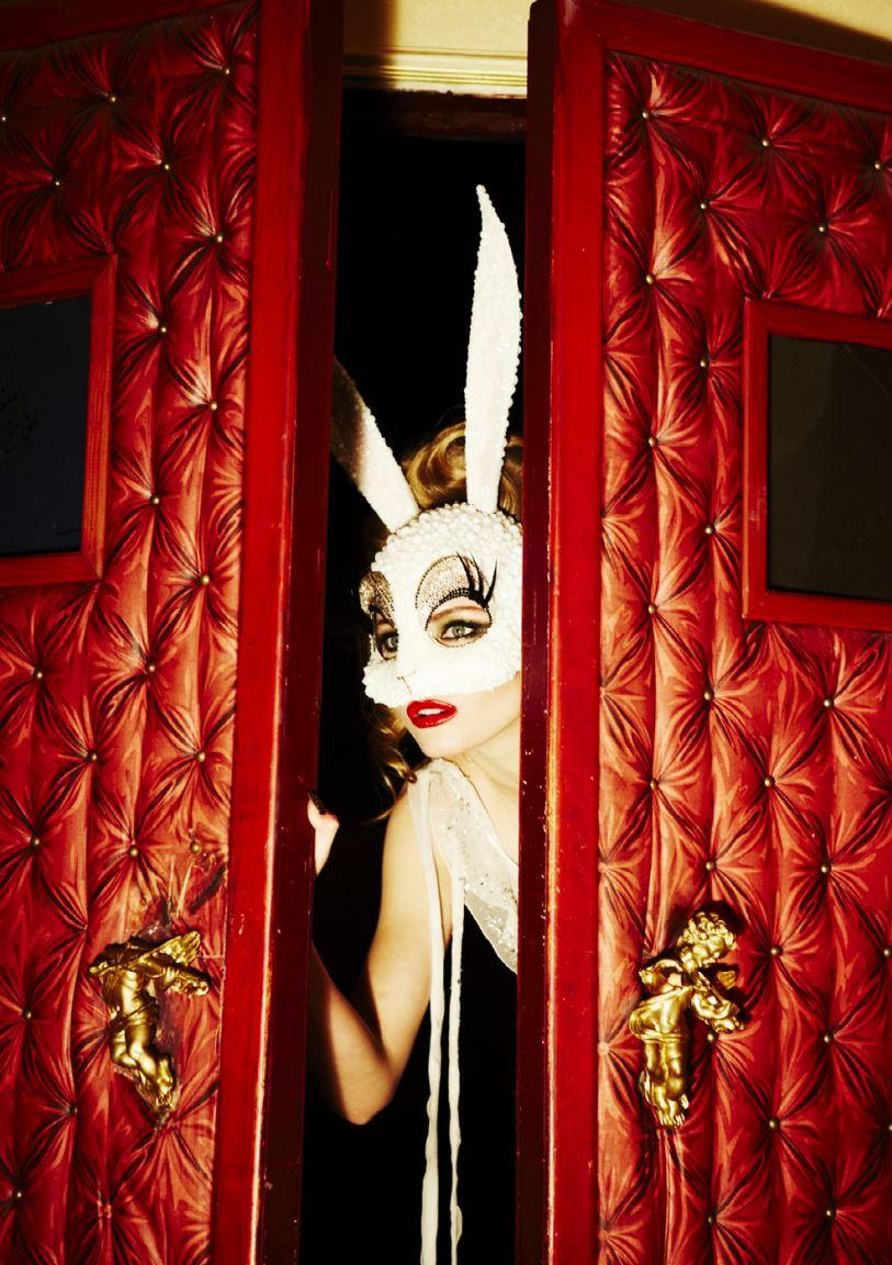 Peeking Bunny - model with a bunny mask looking through a red door