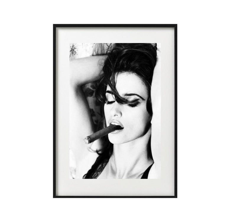 Penelope Cruz smoking Cigar - the actress posing with her arms behind her head - Gray Figurative Photograph by Ellen von Unwerth