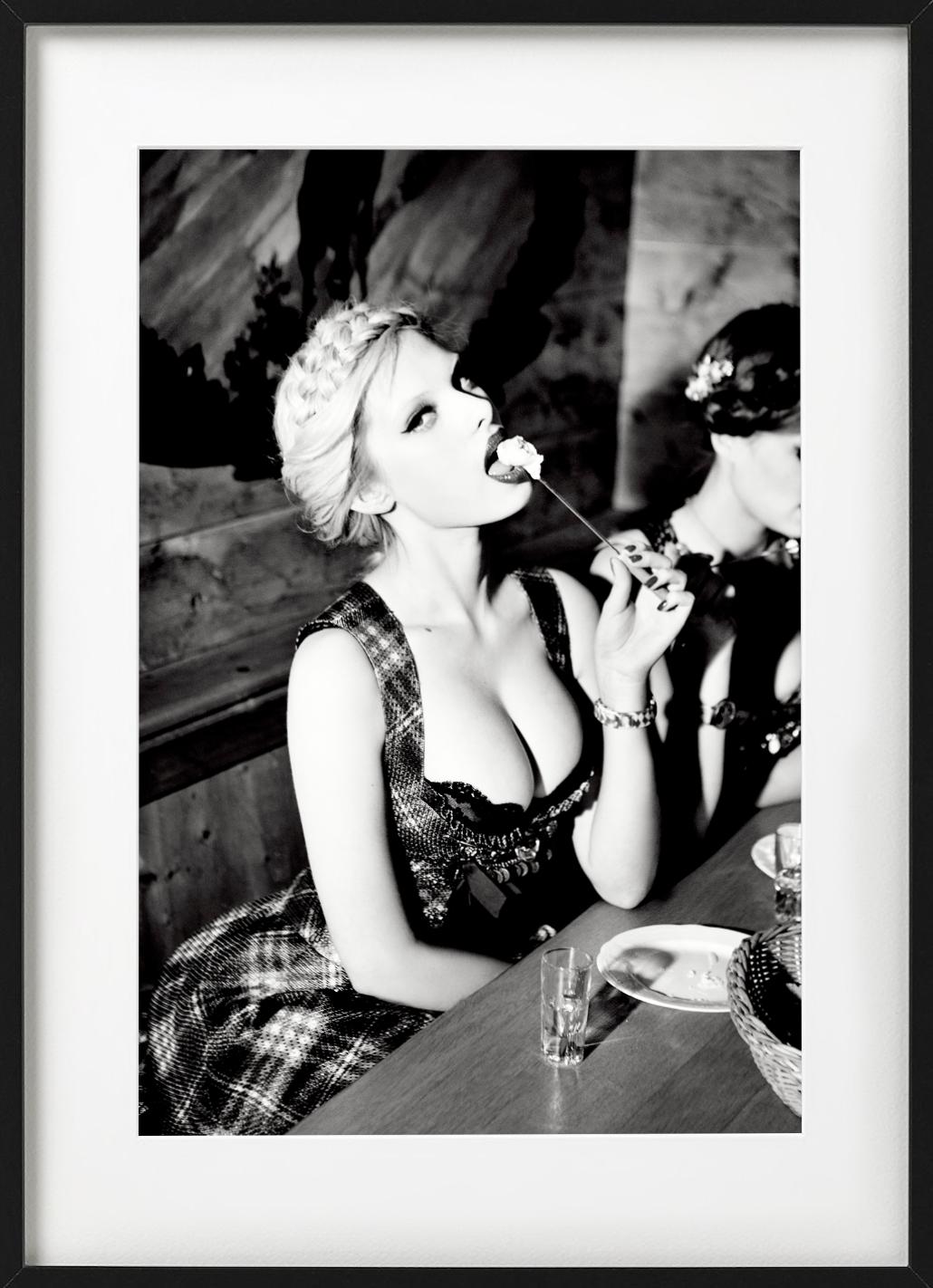 Taste Test - Heimat, Model, traditional dress eating fondue fine art photography - Photograph by Ellen von Unwerth