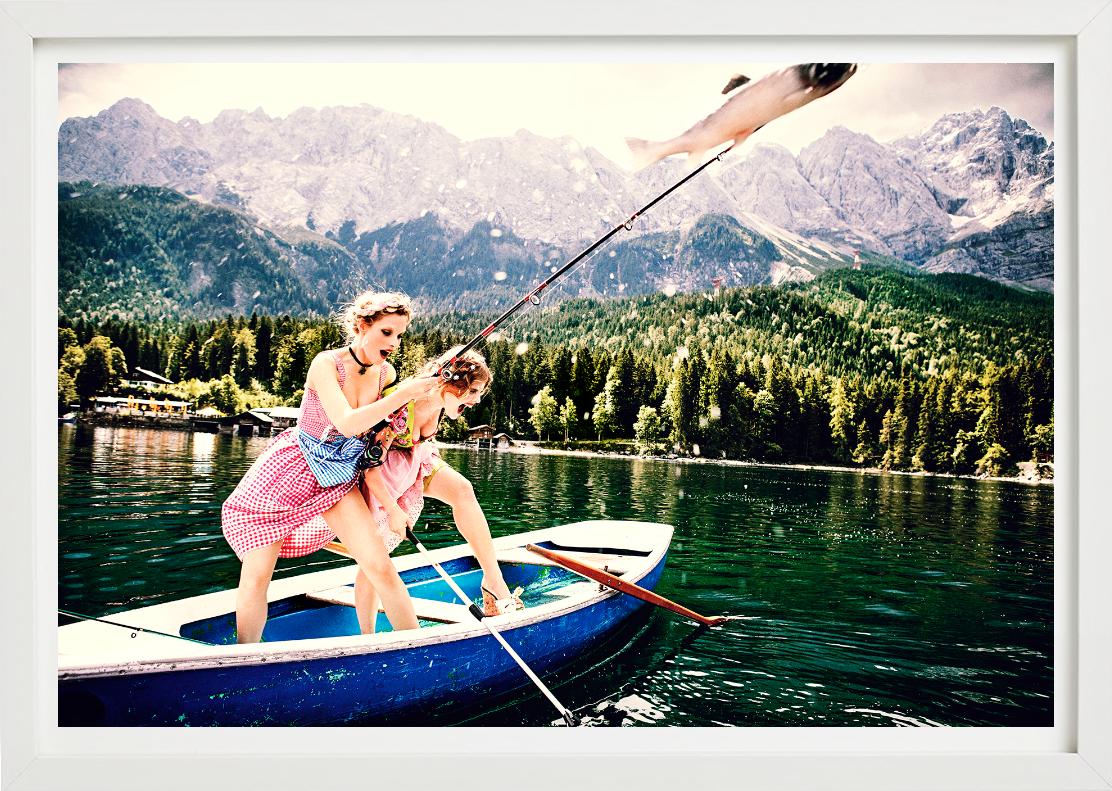 The Big Catch - Due modelle in Dirndl che pescano, Fotografia Fine Art, 2015 - Figurative Photograph Nero di Ellen von Unwerth