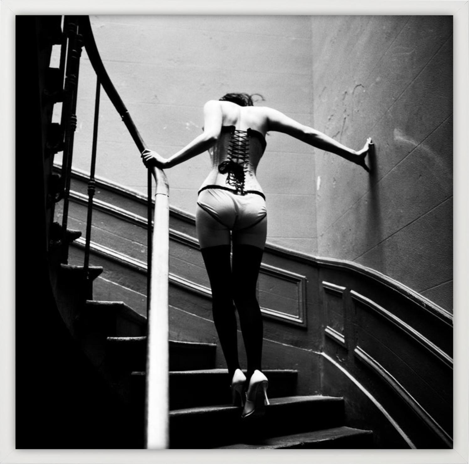 Upstairs, Paris - Model in Lingerie walking up Stairs, fine art photography 1996 - Contemporary Photograph by Ellen von Unwerth